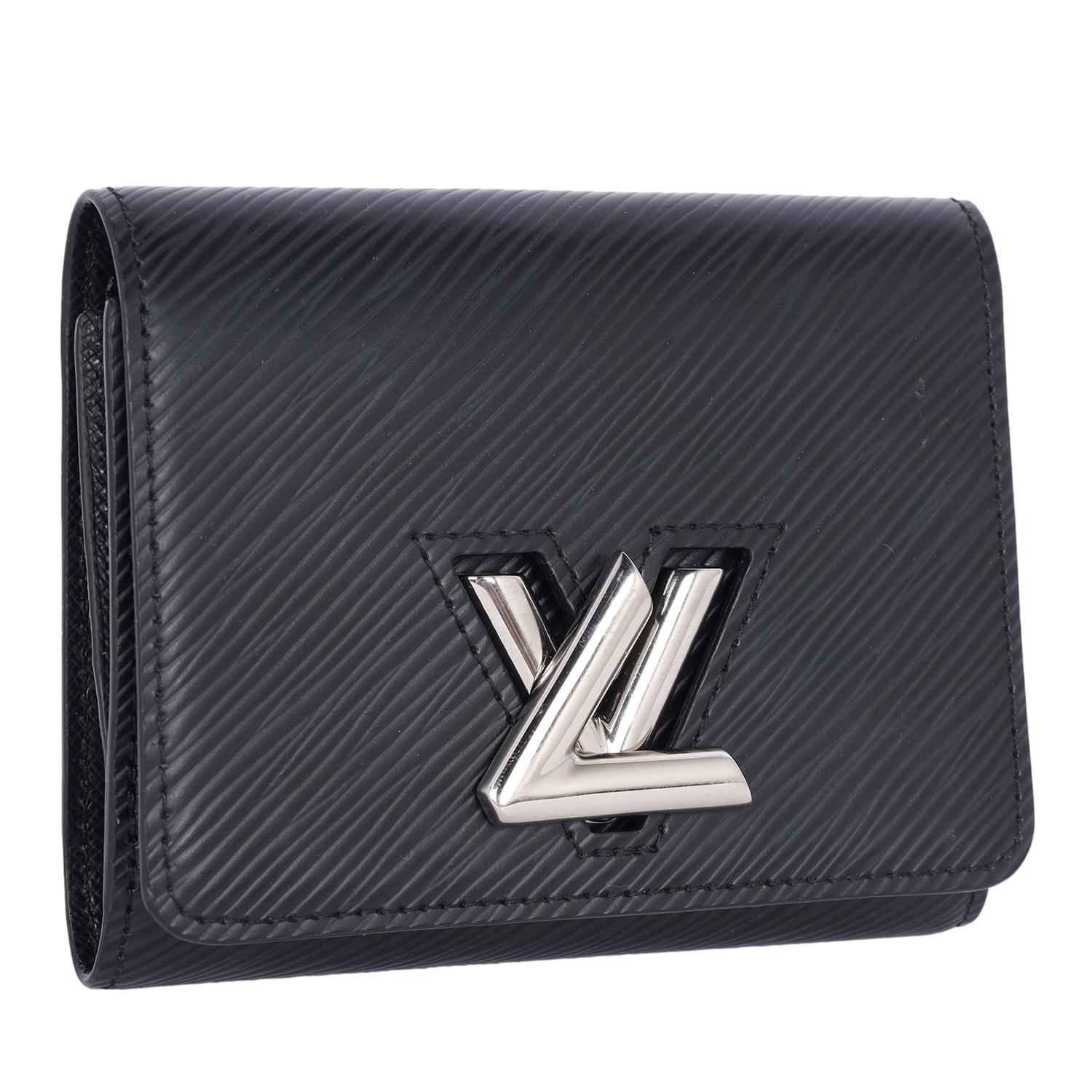Authentic, pre-owned Louis Vuitton Epi Leather Twist Black Wallet. Features Louis Vuitton Epi leather that is known for its durable, textured finish, offering both style and resilience. The bold silver LV twist lock closure adds a striking, polished