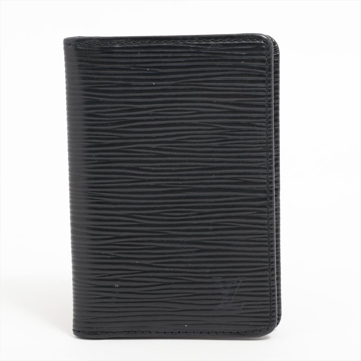 The Louis Vuitton Epi Organizer de Poche Card Case in sleek black a compact and sophisticated accessory that combines functionality with timeless elegance. Crafted from the iconic Epi leather, the card case is a testament to Louis Vuitton's