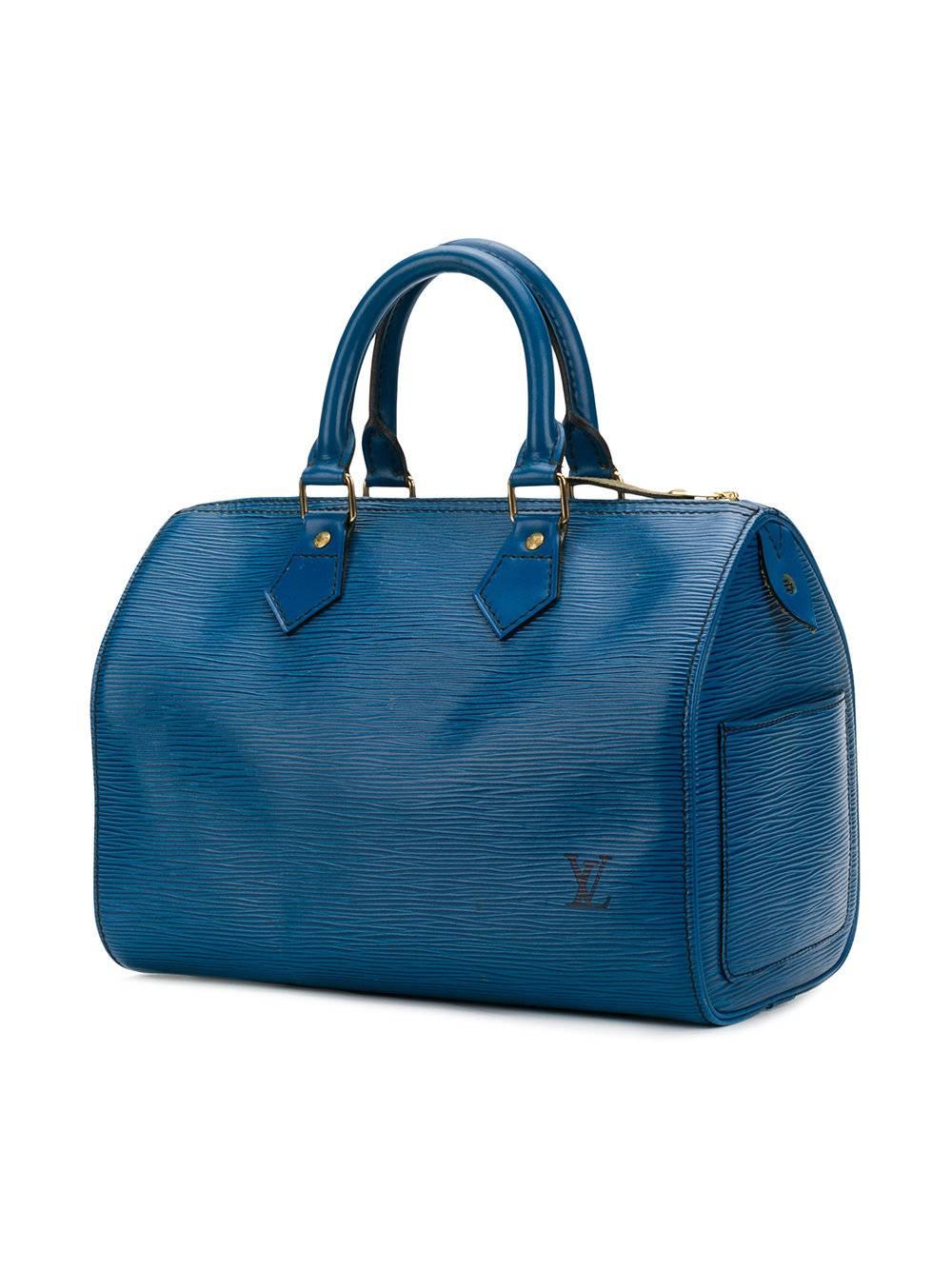 Blue leather Epi textured tote bag from Louis Vuitton Vintage featuring top handles, a main internal compartment and a zip fastening.

Colour: Blue

Material: Epi Leather

Condition: 8/10

This item has been gently used. Some visible marks on the
