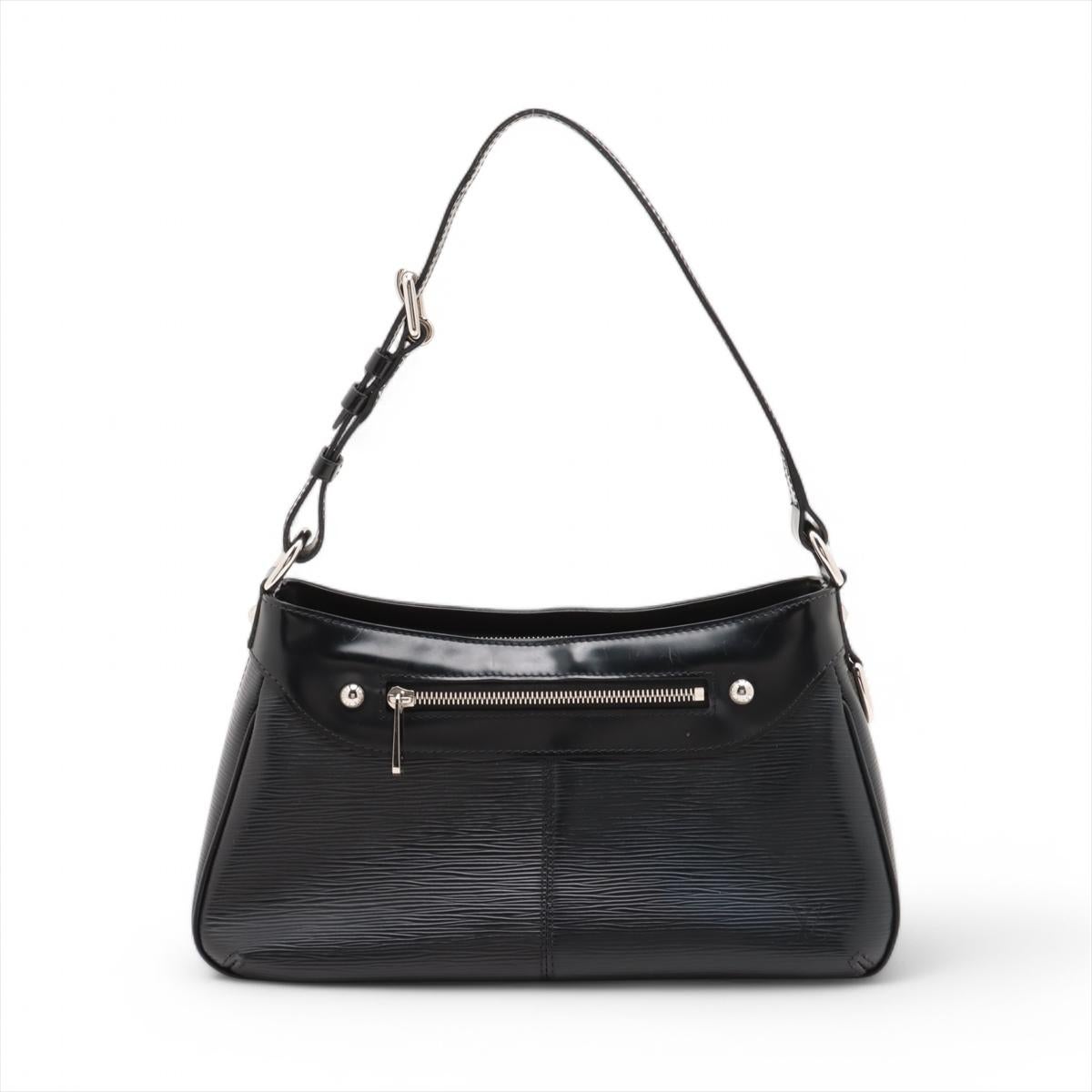 The Louis Vuitton Epi Turenne PM in Black is a refined and versatile shoulder bag that effortlessly combines luxury and functionality. Crafted from the brand’s signature textured Epi leather, the bag features a sleek, structured design with a