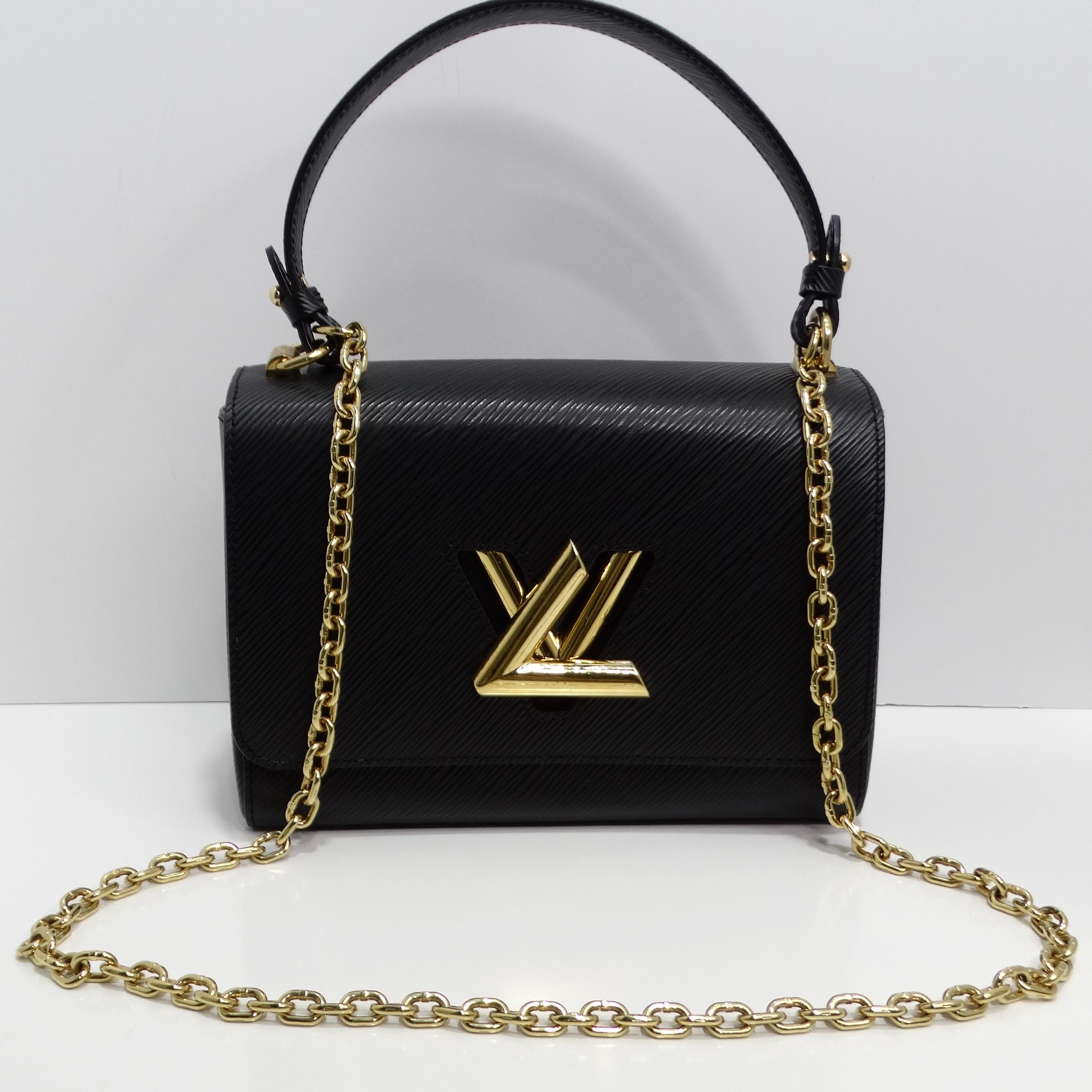 Introducing the Louis Vuitton Epi Twist Top Handle Shoulder Bag, a chic and versatile accessory that seamlessly combines style and functionality. Crafted from textured epi leather in classic black, this shoulder bag exudes sophistication and