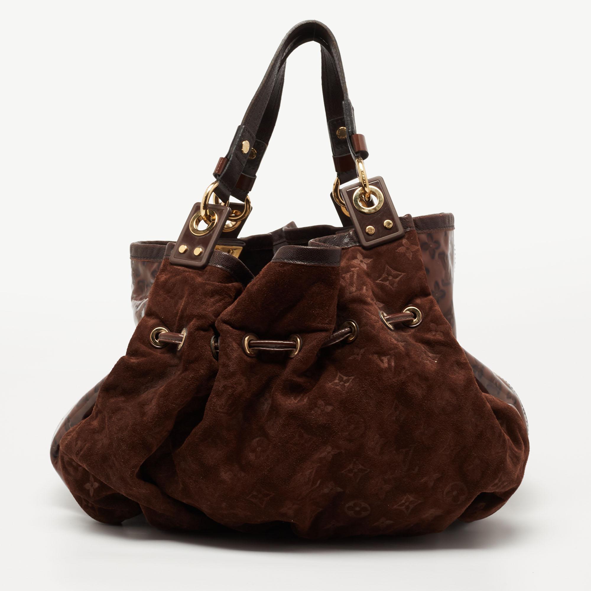 Let this exclusive piece be yours! This Louis Vuitton limited edition Irene bag has been crafted from monogram suede and lined with Alcantara inside. Its exterior has a drawstring detailing and patent leather trims. The top leads way to a spacious