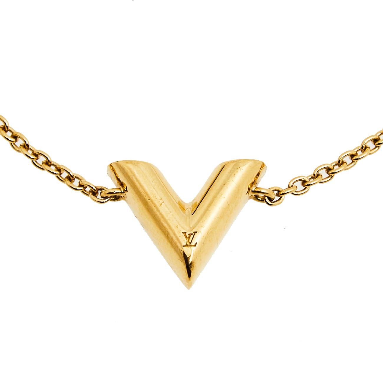 Create an elegant, timeless, and classic addition to both casual and even special events with this beautiful Louis Vuitton Essential V bracelet. Constructed in gold-tone metal, this bracelet features a V charm in the center with LV carving and an