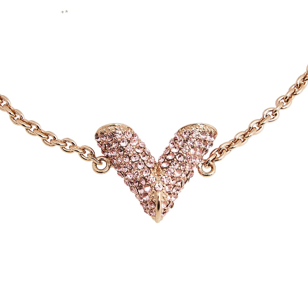 Create an elegant, timeless, and classic addition to both casual and even special events with this beautiful Louis Vuitton Essential V bracelet. Constructed in rose gold-tone metal, this bracelet features a large V charm decked with pink crystals