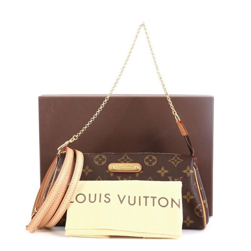 This Louis Vuitton Eva Crossbody Monogram Canvas, crafted from brown monogram coated canvas, features natural vachetta leather trim, adjustable leather strap, chain link strap, and gold-tone hardware. Its zip closure opens to a brown fabric