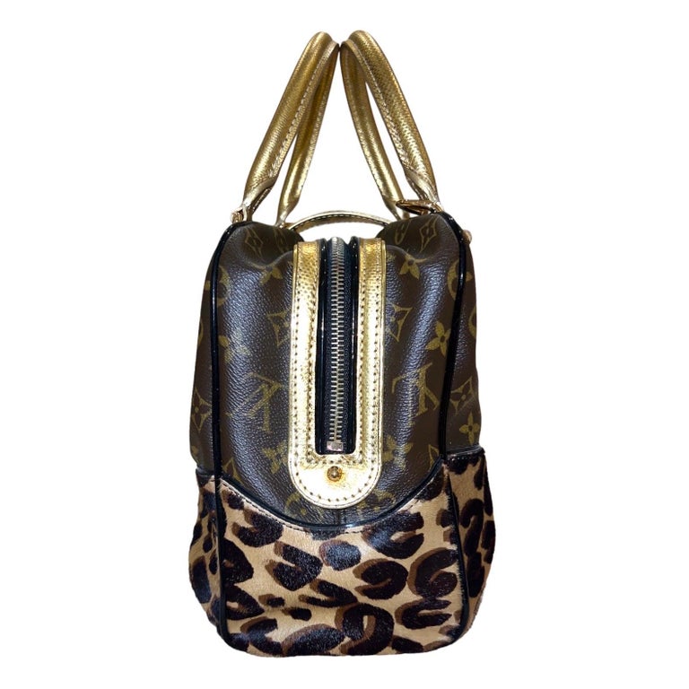 Limited Edition! A collector’s dream!
Louis Vuitton Top Handle Bag
Designed by Marc Jacobs for the Vuitton Fall 2006 collection 
A rare tribute piece for designer Stephen Sprouse 
So versatile, goes day & night with every outfit
A classic bag with a