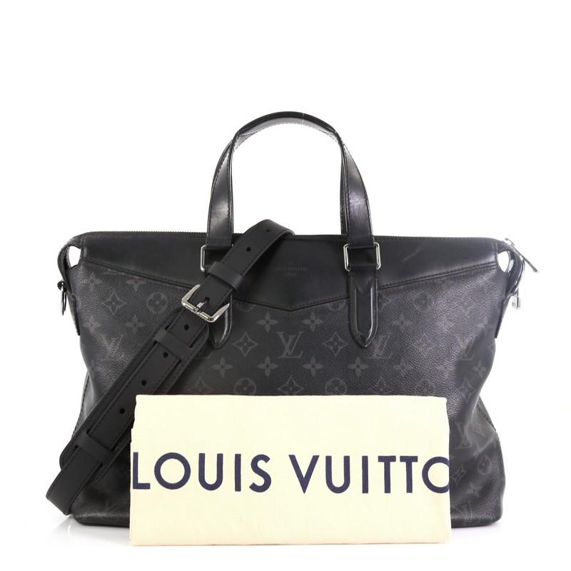 This Louis Vuitton Explorer Briefcase Monogram Eclipse Canvas, crafted in black eclipse monogram coated canvas, features dual-flat leather handles, adjustable shoulder strap, black leather trims, and silver-tone hardware. Its zip closure opens to a