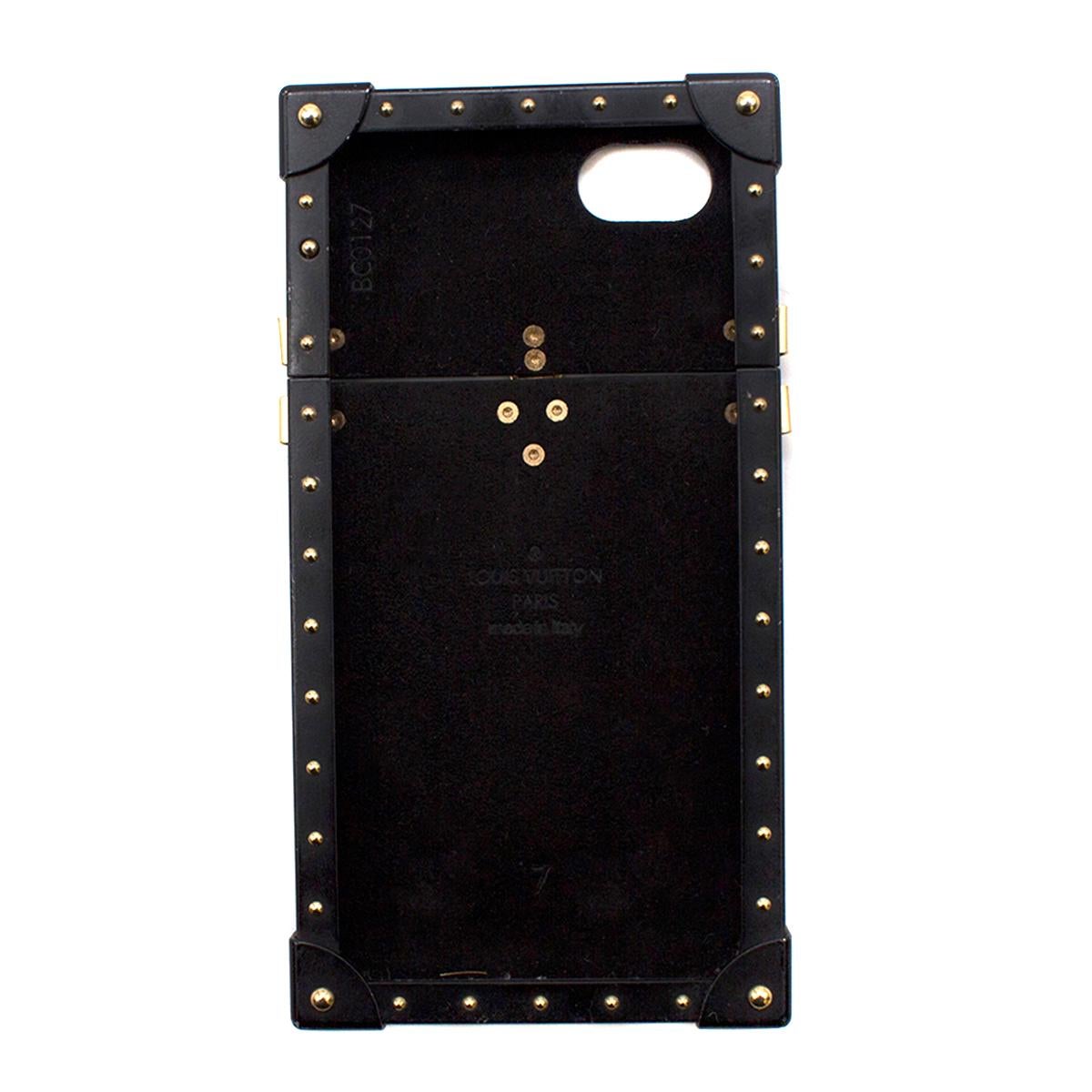 Louis Vuitton Eye-Trunk iPhone 6 & 6s holder 

- Tonal-brown Monogram print, coated canvas 
- Trunk shaped hard iPhone case
- Black metal edges, gold-tone metal studs and logo-engraved faux clasp 
- Compatible with the iPhone 6 and 6s 
- Date stamp:
