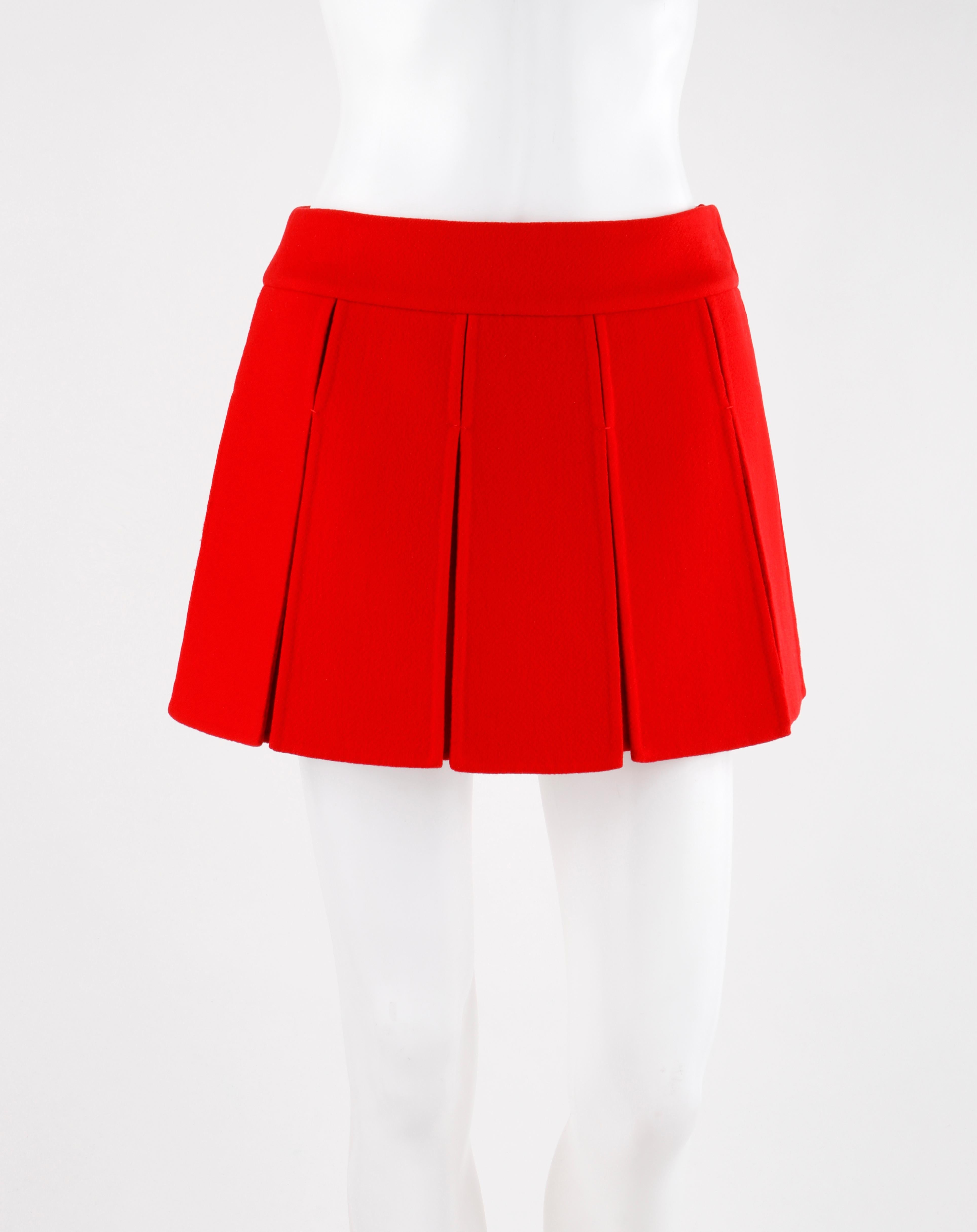 LOUIS VUITTON Red Cashmere Mini Gladiator Pleated Skirt

Brand / Manufacturer: Louis Vuitton
Collection: Ready to wear, fall 2003
Designer: Marc Jacobs
Style: Mini Pleated Skirt
Color(s): Red
Lined: Partially lined- waistband
Marked Fabric Content: