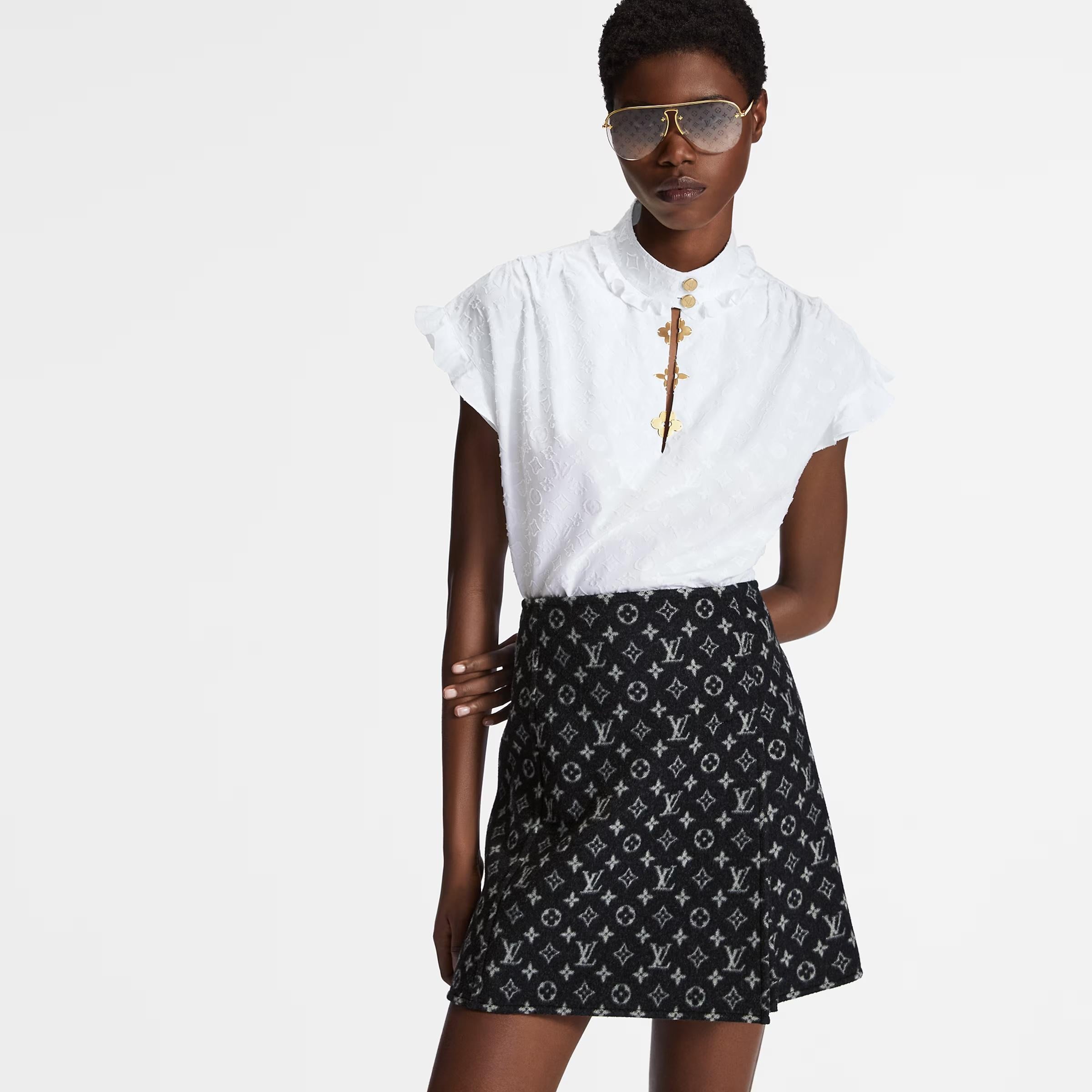 Super cool Louis Vuitton monogram blouse from the Fall 2019 collection. Bought for £950 and worn once - has been newly dry cleaned. Made from soft white cotton poplin with a textured LV monogram weave with monogram flower shaped gold-tone clasps to