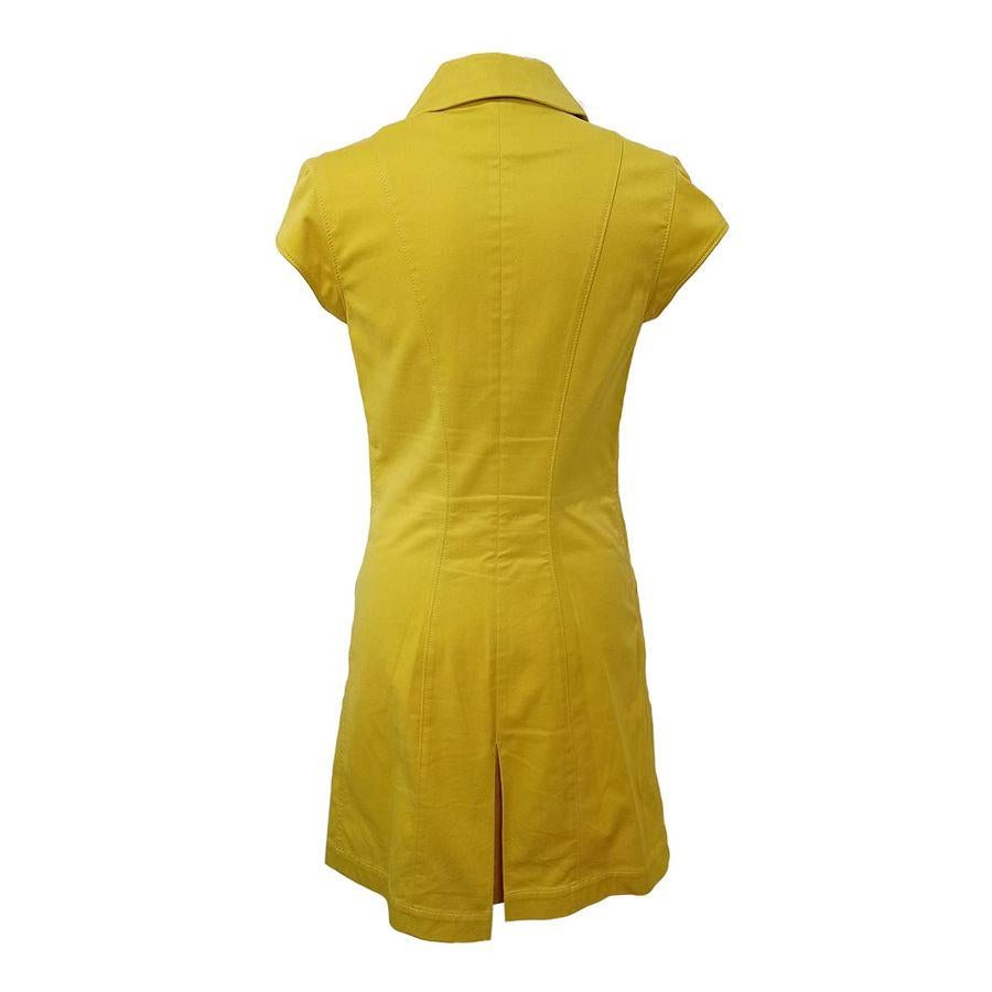 Cotton (98%) Elasthane (2%) Mustard yellow color Two pockets Short sleeves Front zip closure Total length cm 90 (3543 inches) Shoulders cm 36 (1417 inches) French size 38 italian size 42
