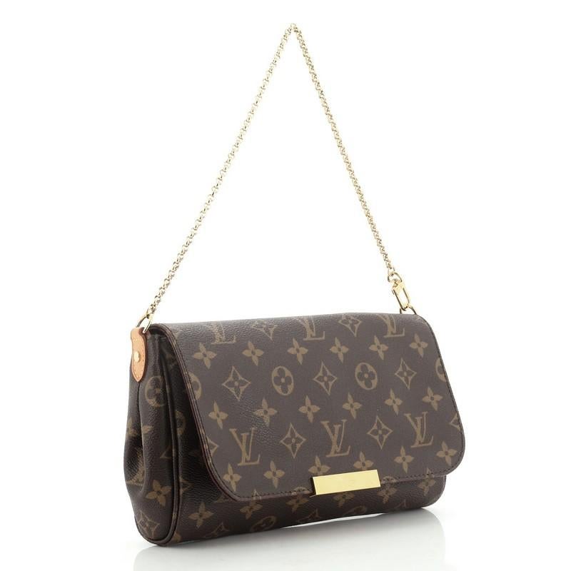 This Louis Vuitton Favorite Handbag Monogram Canvas MM, crafted from brown monogram coated canvas, features a chain strap, LV plated logo, and gold-tone hardware. Its hidden magnetic closure opens to a purple fabric interior with slip pocket.