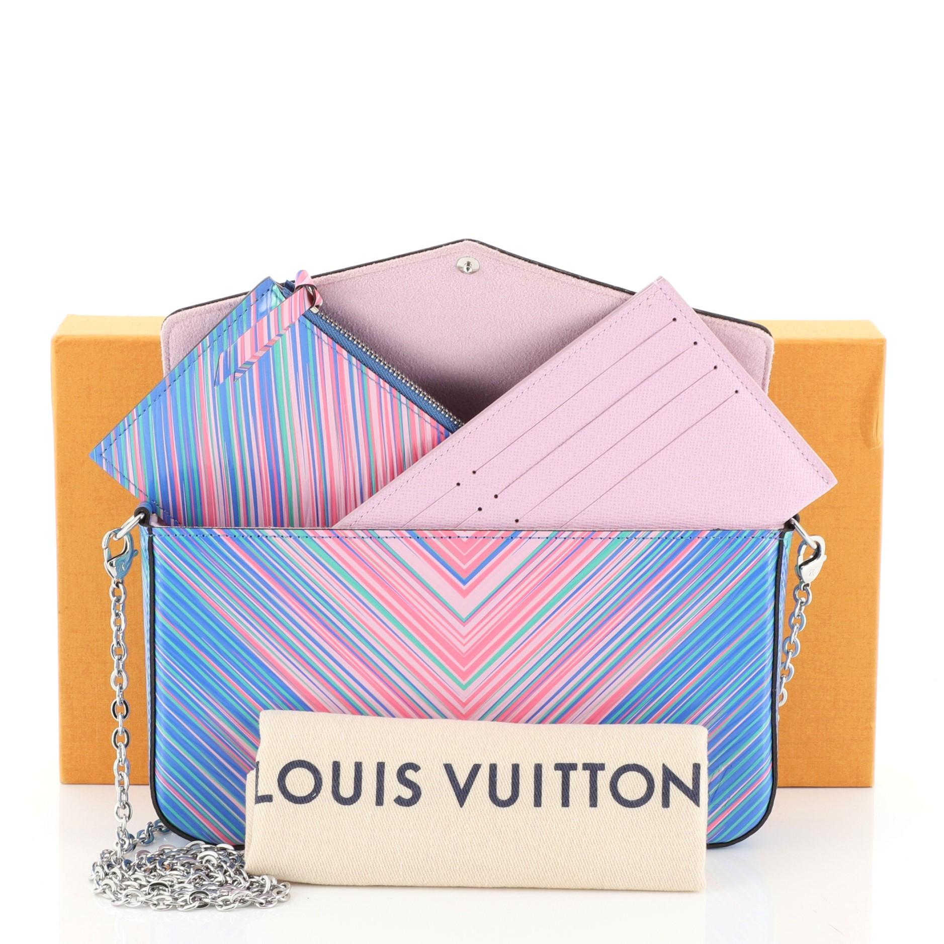 This Louis Vuitton Felicie Pochette Limited Edition Tropical Epi Leather, crafted from tropical printed epi leather, features detachable chain-link strap, and silver-tone hardware. Its press stud closure opens to a purple microfiber interior.