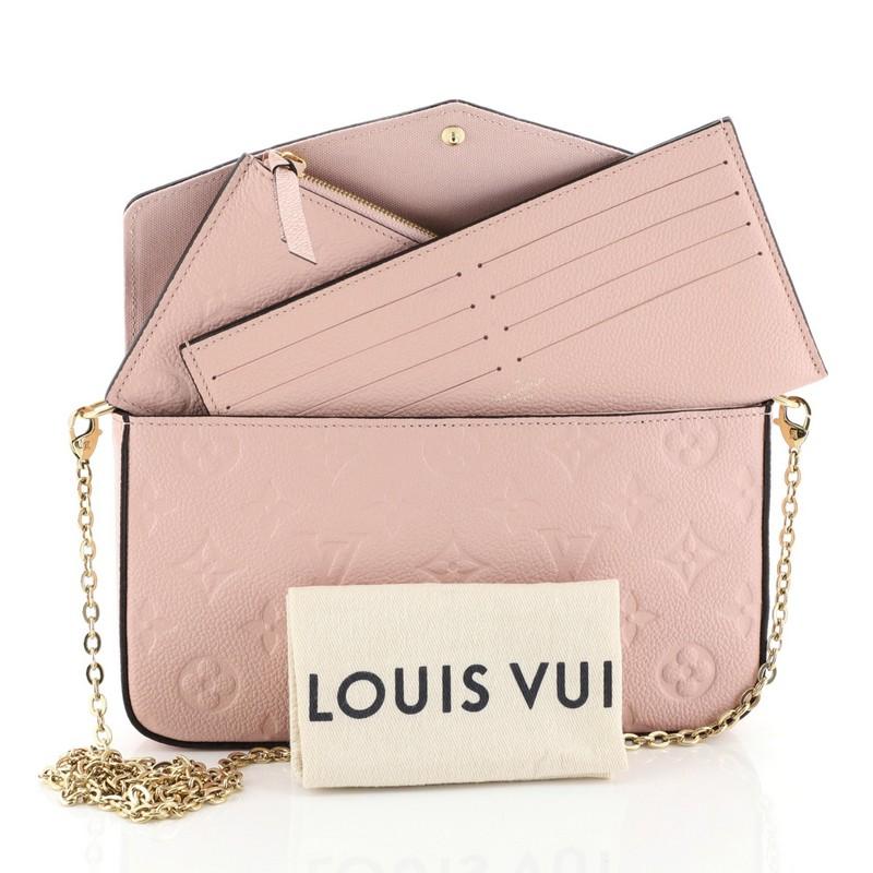 his Louis Vuitton Felicie Pochette Monogram Empreinte Leather, crafted from pink monogram empreinte leather, features detachable chain-link strap and gold-tone hardware. Its press stud closure opens to a pink fabric interior with slip pocket.