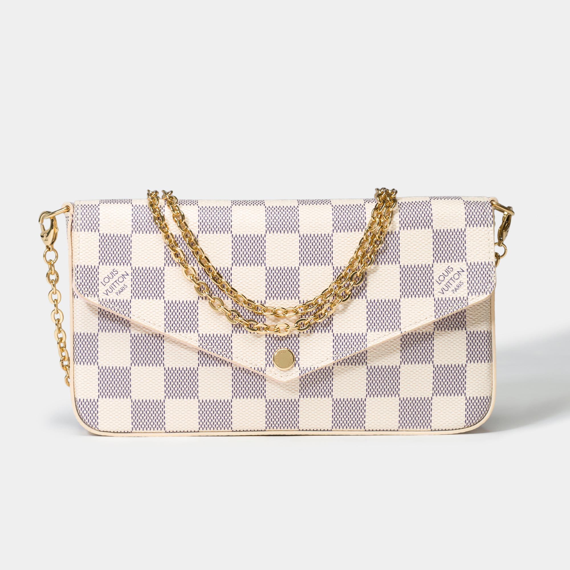 This​ ​Félicie​ ​Pochette​ ​in​ ​Damier​ ​Azur​ ​canvas​ ​is​ ​perfect​ ​for​ ​modern​ ​lifestyles.​ ​Its​ ​flap​ ​opens​ ​to​ ​reveal​ ​a​ ​spacious​ ​compartment​ ​with​ ​two​ ​removable​ ​pockets:​ ​one​ ​has​ ​a​ ​zipper,​ ​the​ ​other​ ​has​