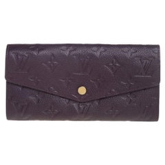 Louis Vuitton Black Monogram Empreinte Sarah Wallet M61182 For Sale at  1stDibs