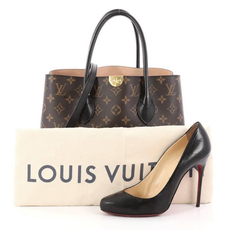 This authentic Louis Vuitton Flandrin Handbag Monogram Canvas is an exquisite piece from the brand that embraces a fresh shape, with clean lines and gorgeous details. Crafted from brown monogram coated canvas with black leather trims, this bag