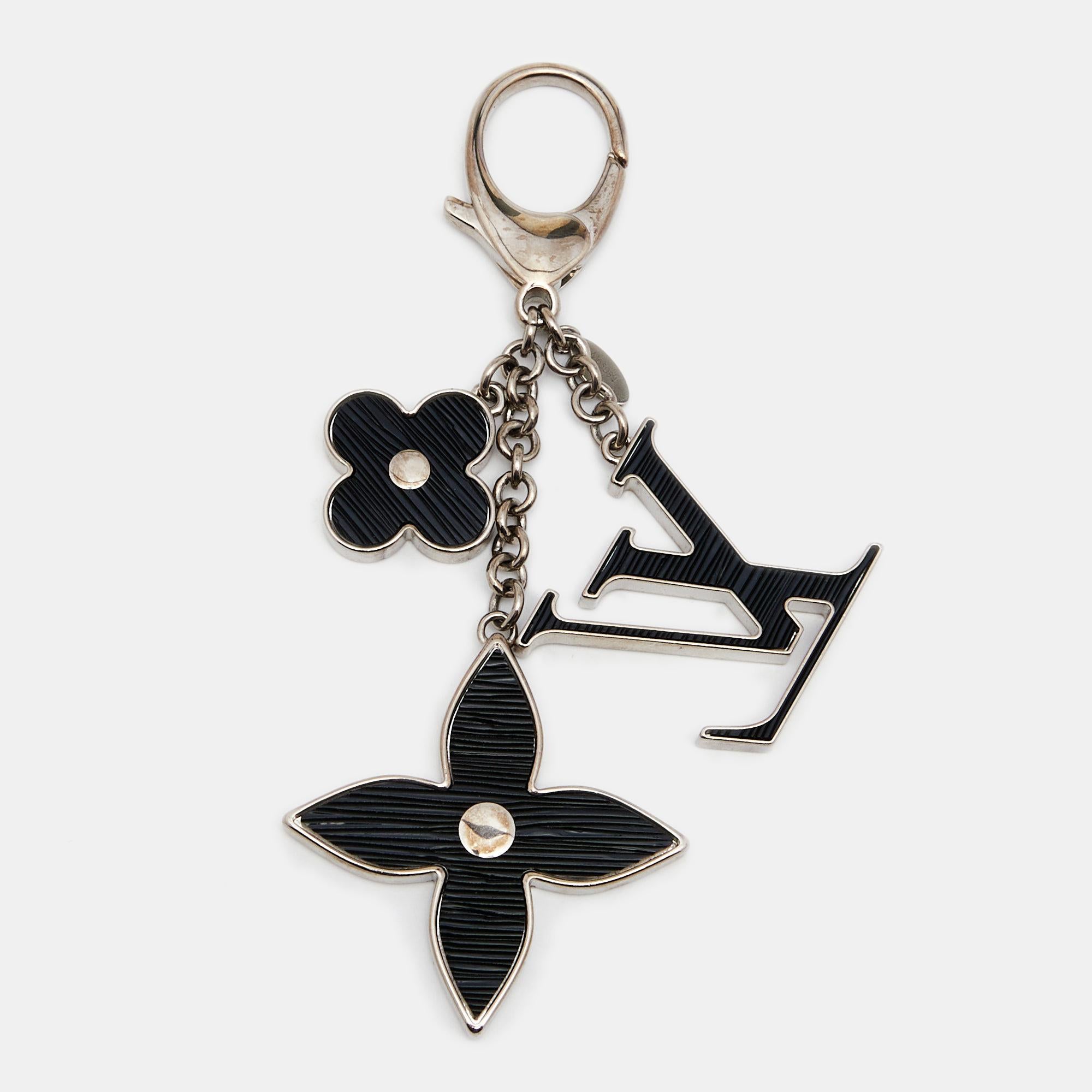 Louis Vuitton’s bag charm is for every LV fan or handbag lover. With monogram flowers and the LV logo attached to silver-tone chains, this piece is sure to delight your bag collection. It is completed with the brand's label engraved on the lobster