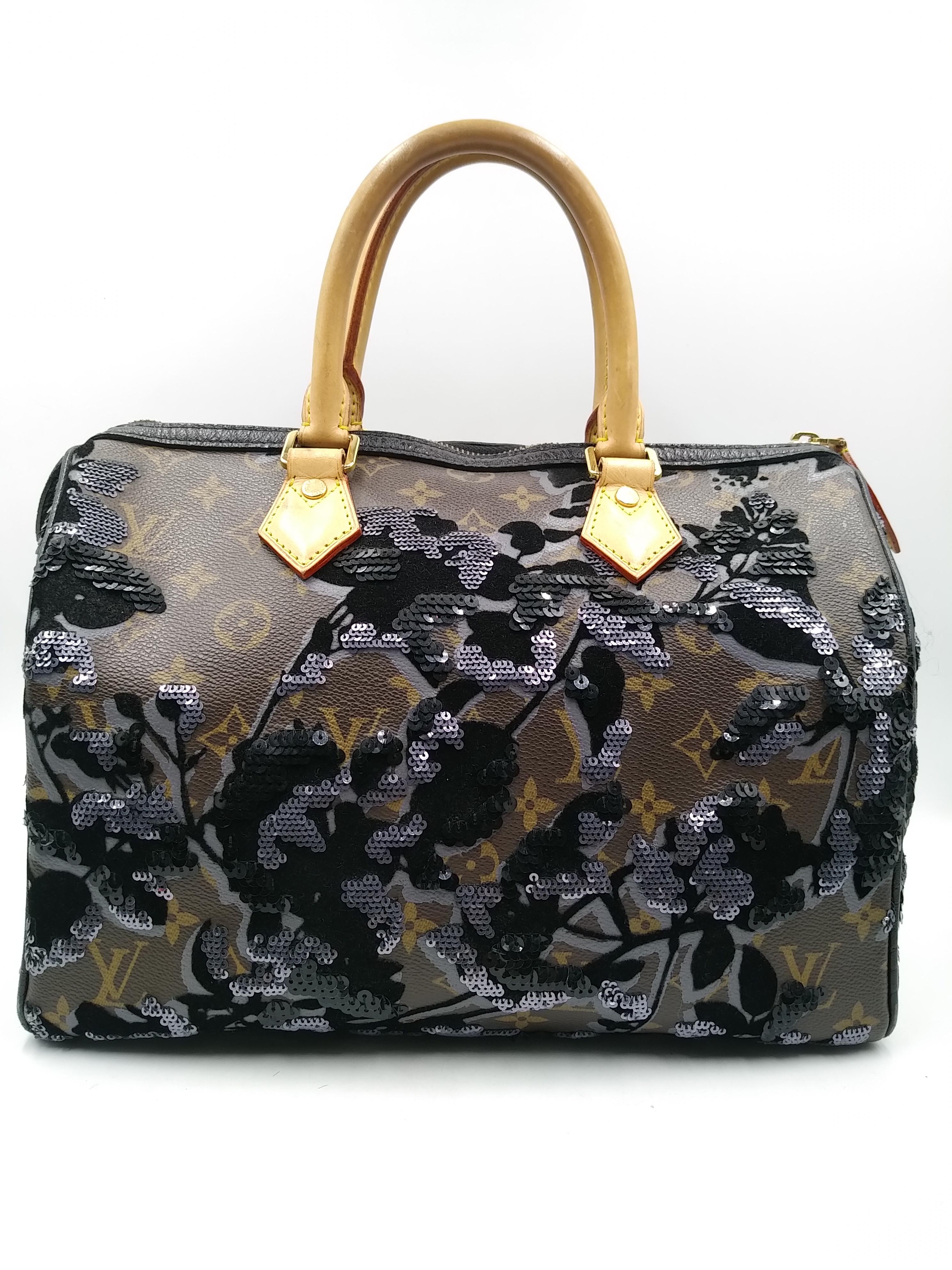 Louis Vuitton Limited Edition Fleur De Jais Speedy 30 Bag, Fall/Winter 2010.
-100% authentic Louis Vuitton
- Monogram coated canvas, sequins and natural leather trim
- One pocket inside
- Double rolled leather handles
- Single zip closure
- Fine