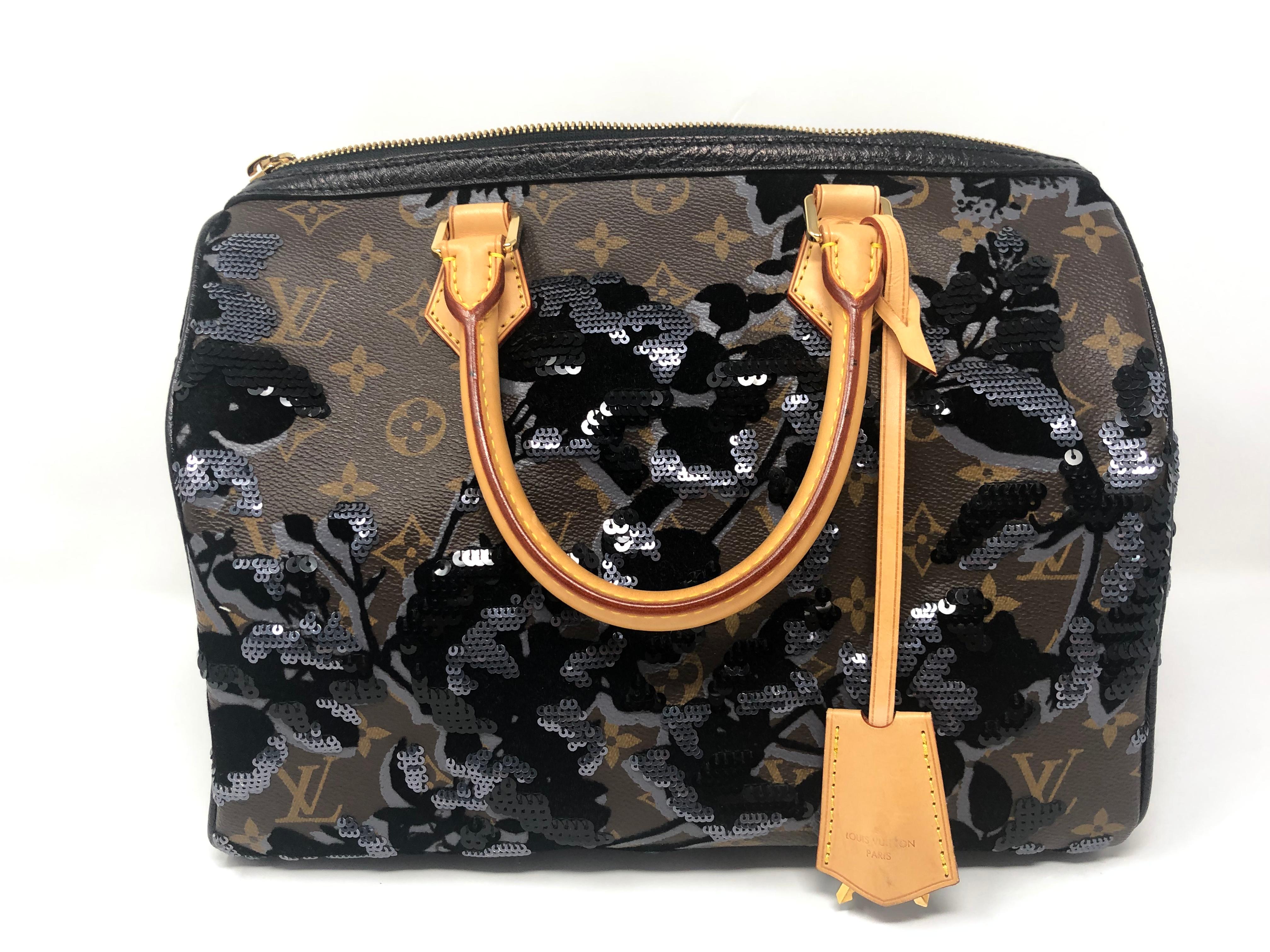 Louis Vuitton Fleur De Jais Sequin Speedy 30. Coated monogram canvas with velvet, sequins, and leather to adorn this classic speedy bag. Rare and limited. Very good condition. Includes lock, key, clochette, and dust cover. A true collector's piece.