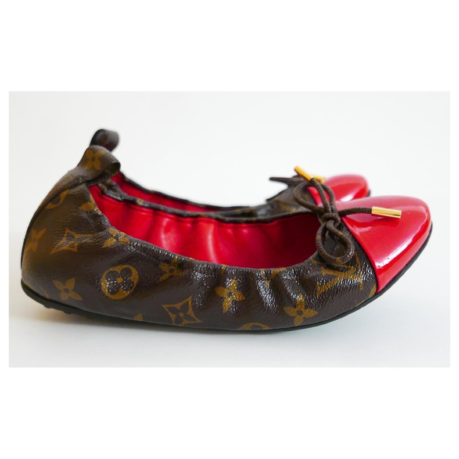 Cute and chic Louis Vuitton Flirty ballet flats. Unworn with dustbag. Made from signature monogram canvas with a glossy red patent leather toe caps and bow trims with etched goldtone tips. Have elasticated sides and semi flexible soles. size 38M.