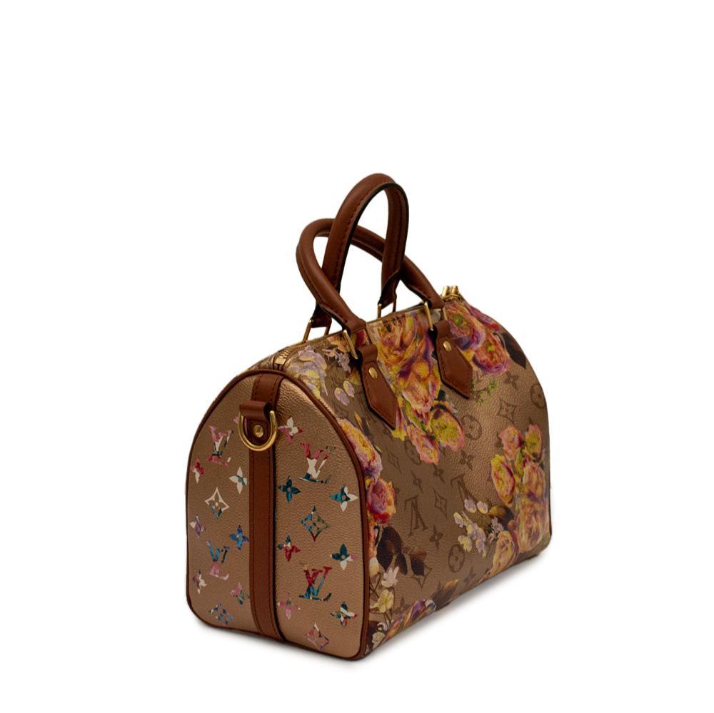 This Gold Speedy Flower Garden Bandoulière 25 features a striking floral print of buttercups on metallic-gold-coloured coated canvas. Designer Nicolas Ghesquière's admiration for flowers is evident in this exclusive animated pattern revealed during