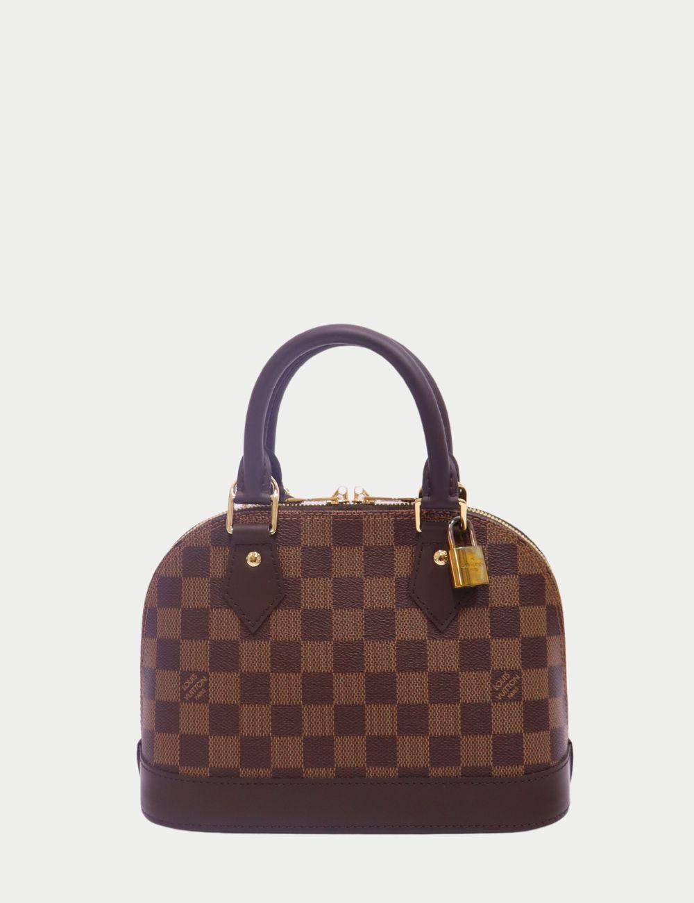 Louis Vuitton Alma BB in Damier Ebene Canvas

A timeless icon in a perfectly petite size — the Louis Vuitton Alma BB in Damier Ebene is the definition of Parisian elegance. Crafted in the signature checkered coated canvas with rich chocolate leather