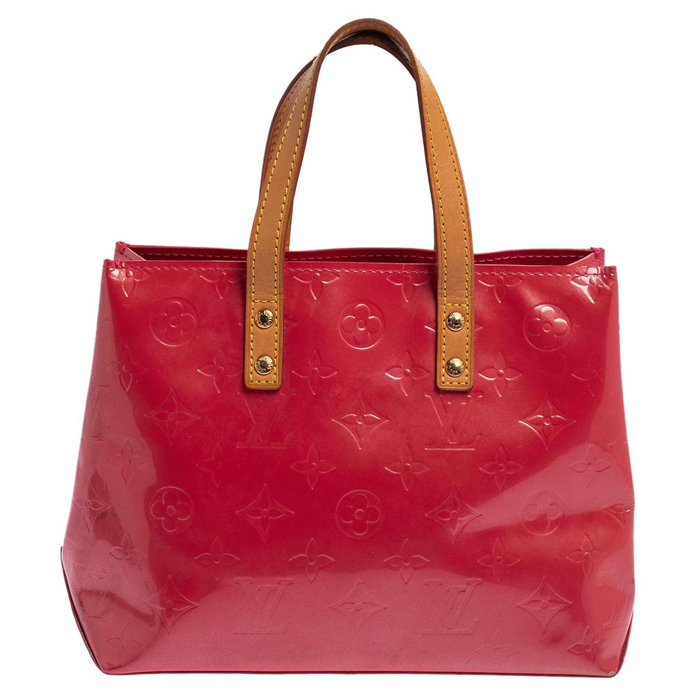 The Reade PM from Louis Vuitton is a fine everyday bag! Wonderfully made from Monogram Vernis, this bag has a lovely shape, a well-sized fabric interior, and two leather handles for you to parade it. Make it yours today.

Includes: 
             