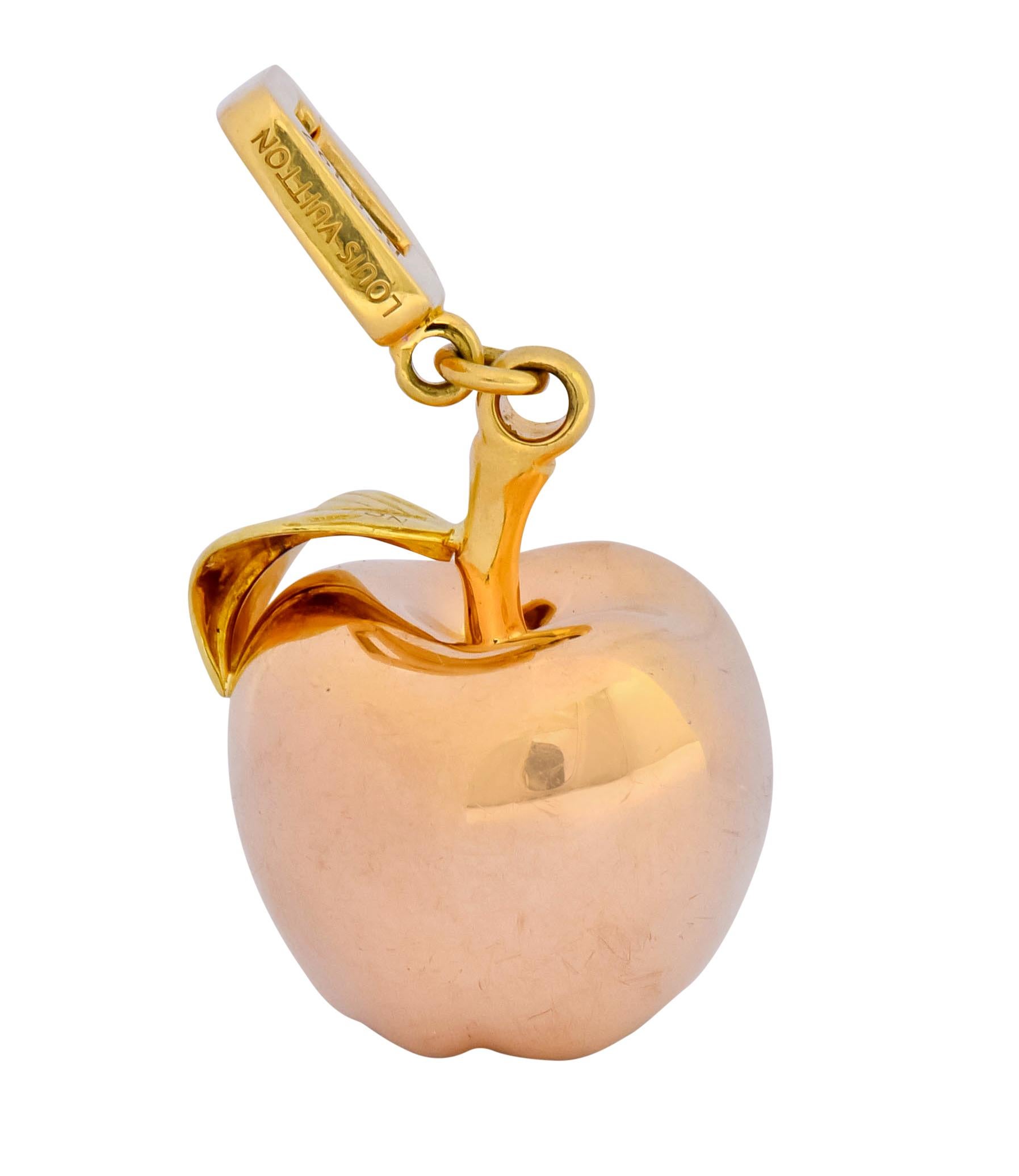 Designed as a high polished solid rose gold apple

Accented with a green gold leaf and yellow gold stem and articulated bale

Bale is fully signed, numbered, and stamped 750 for 18 karat gold

With French assay marks

Circa: 2000's

Pendant length: