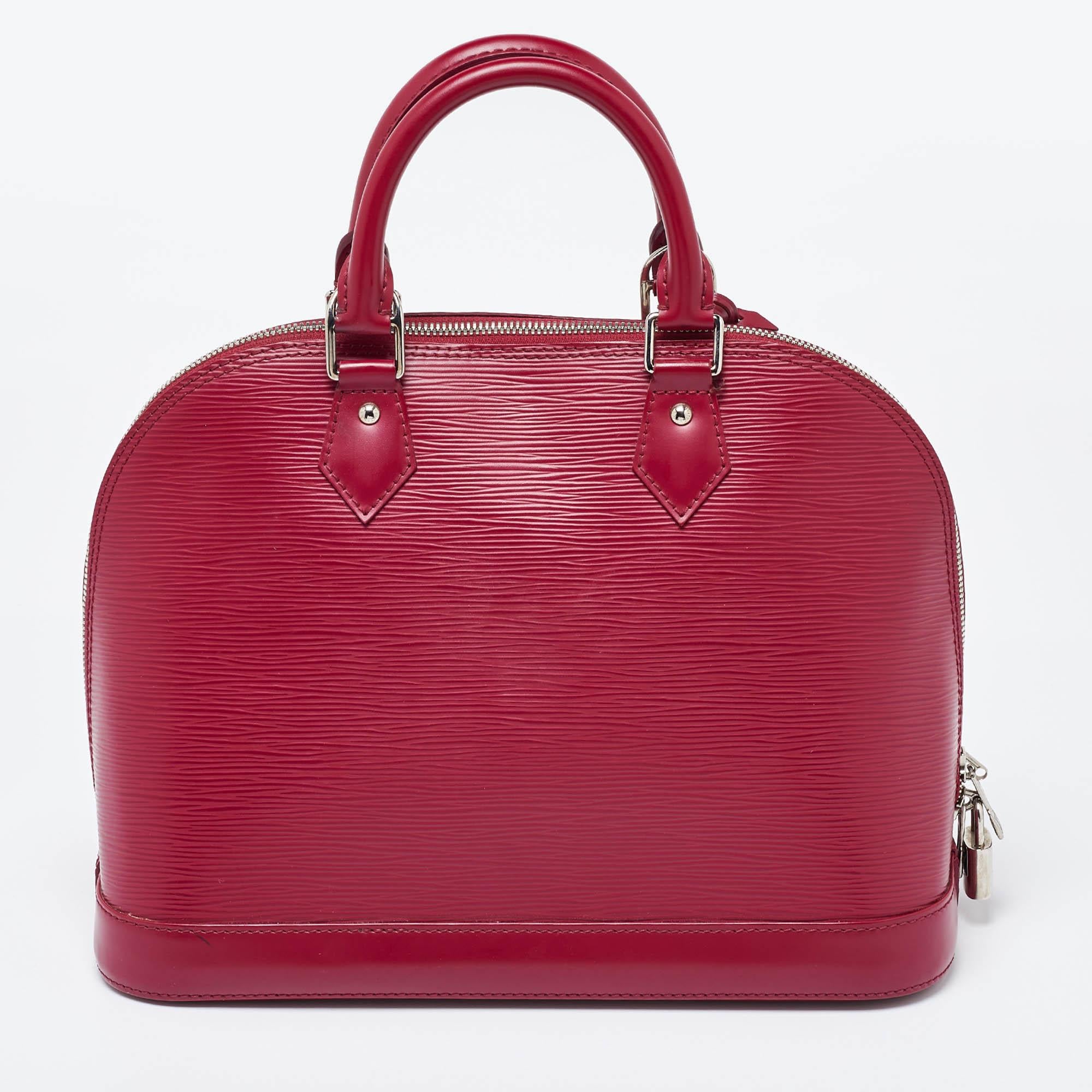 Louis Vuitton Fuchsia Epi Leather Alma PM Bag In Good Condition For Sale In Dubai, Al Qouz 2