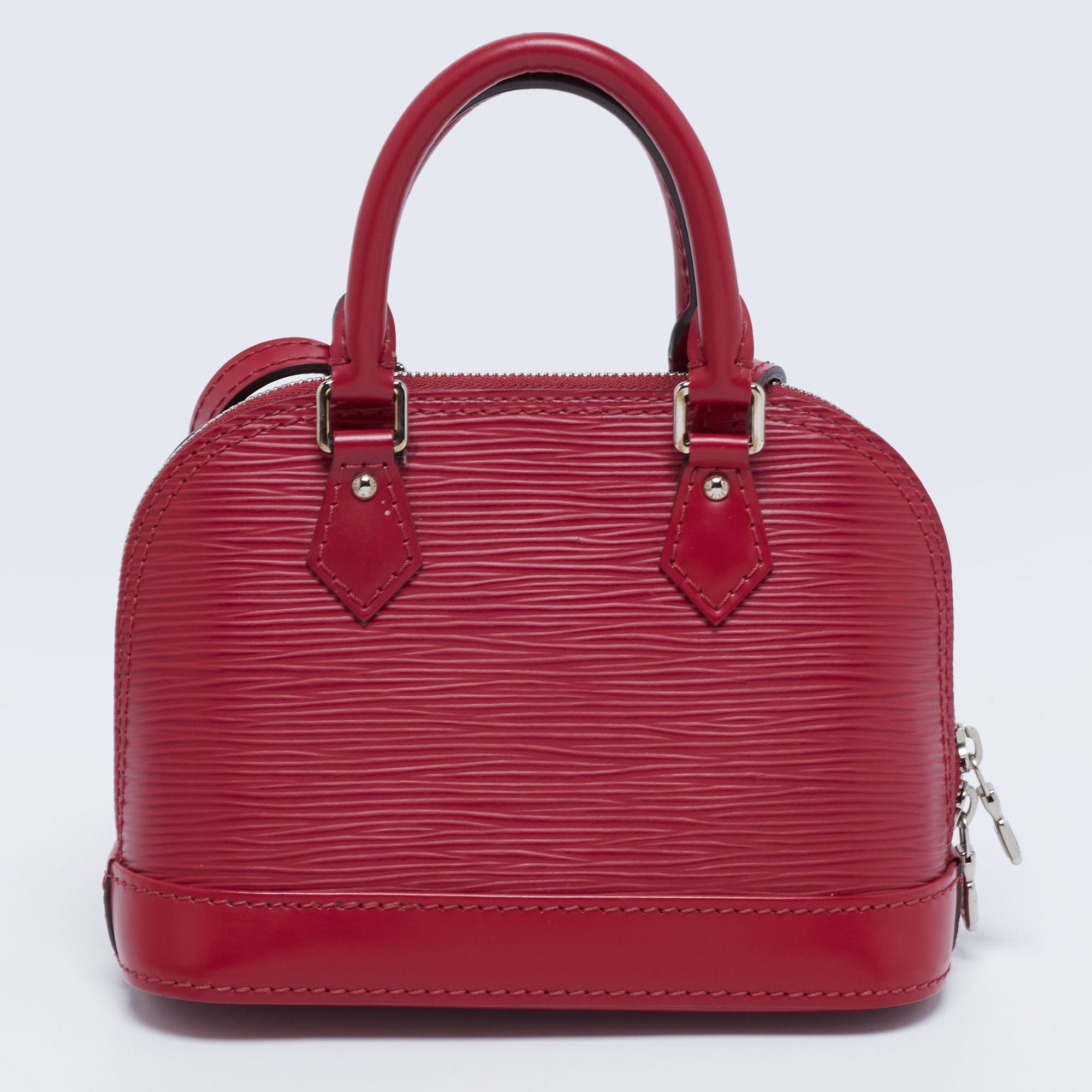The iconic Louis Vuitton Alma is presented in fuchsia Epi leather for this piece. It has double zippers, an Alcantara interior, top handles, and an optional strap. Add a piece of handbag history to your collection today!

