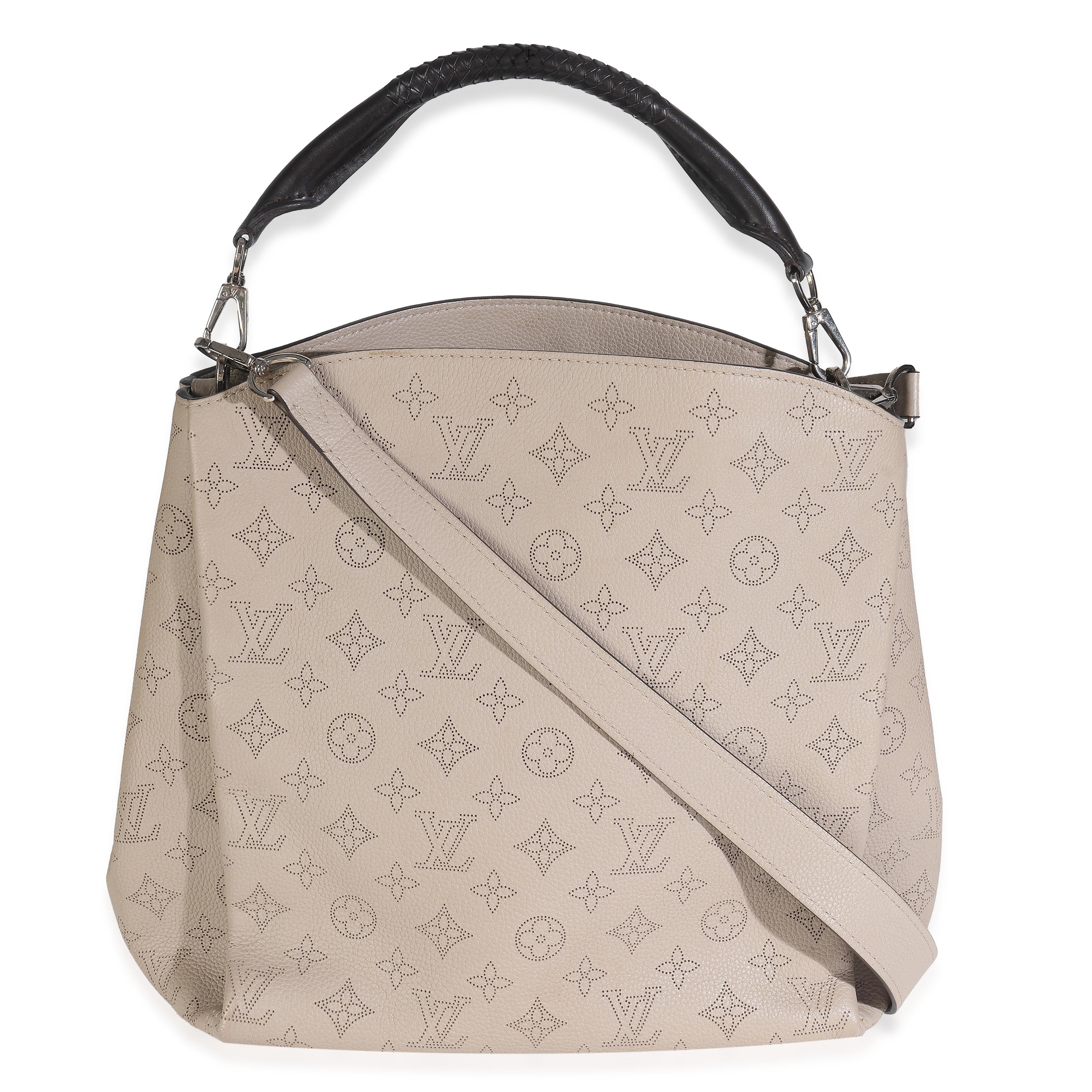 Listing Title: Louis Vuitton Galet Monogram Mahina Babylone PM
SKU: 148135
MSRP: 4150.00 USD
Condition: Pre-owned 
Handbag Condition: Excellent
Condition Comments: Item is in excellent condition and displays light signs of wear. Scratches at