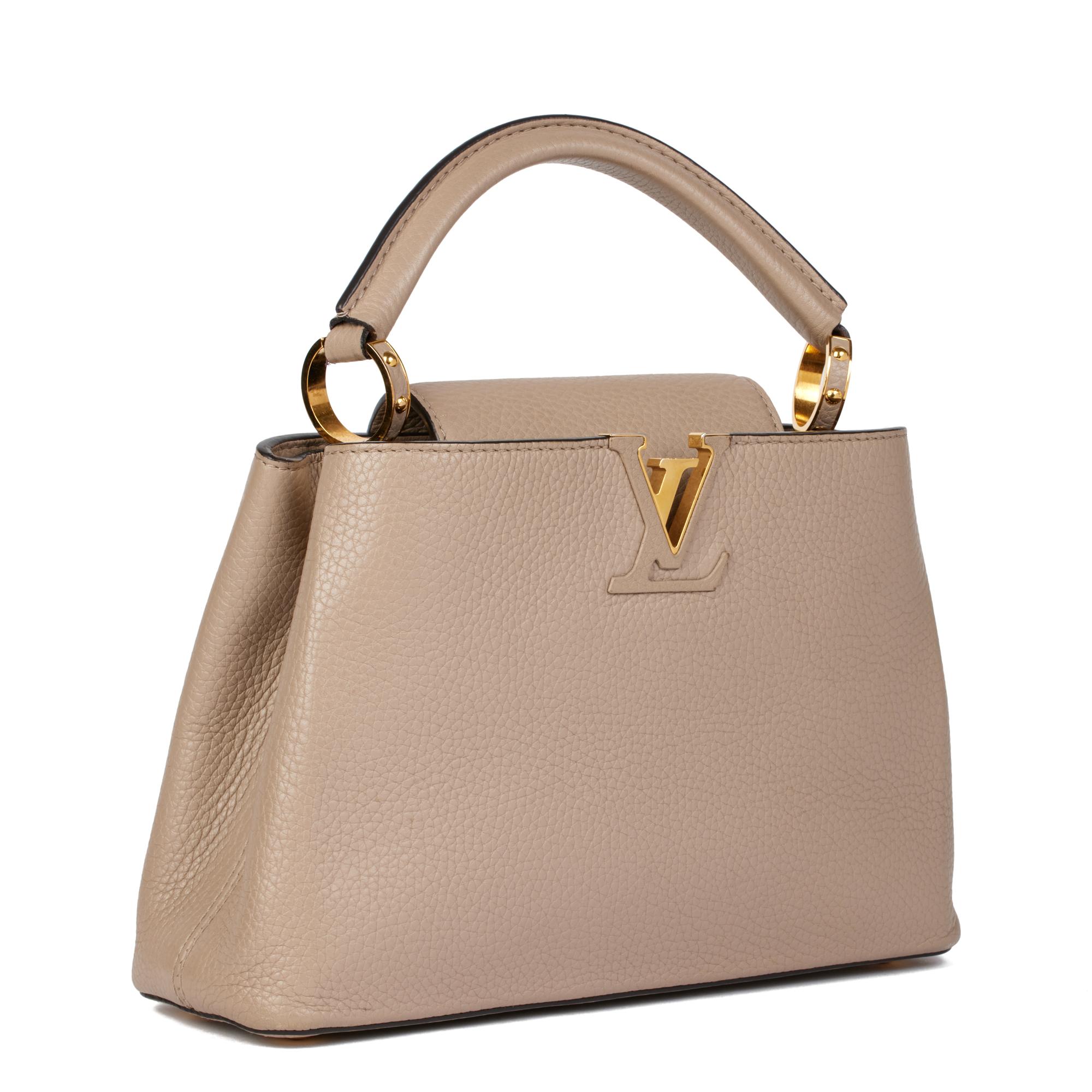 LOUIS VUITTON
Galet Taurillion Leather Capucines BB

Serial Number: MI 2145
Age (Circa): 2015
Accompanied By: Louis Vuitton Dust Bag, Shoulder Strap
Authenticity Details: Date Stamp (Made in France)
Gender: Ladies
Type: Top Handle. Shoulder,