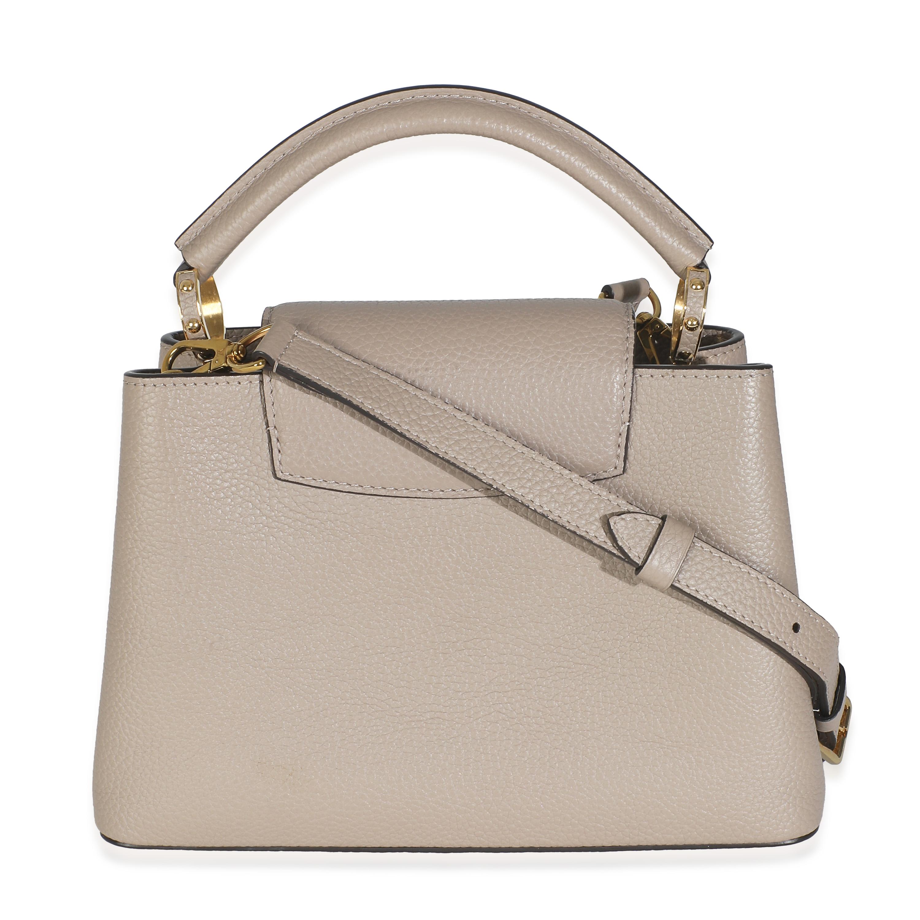 Listing Title: Louis Vuitton Galet Taurillon Capucines BB
SKU: O146464
Condition: Pre-owned 
Condition Description: The Louis Vuitton Capucines bag was created with the brand's house codes in mind. Encapsulating the maison's DNA, the Capucines bag