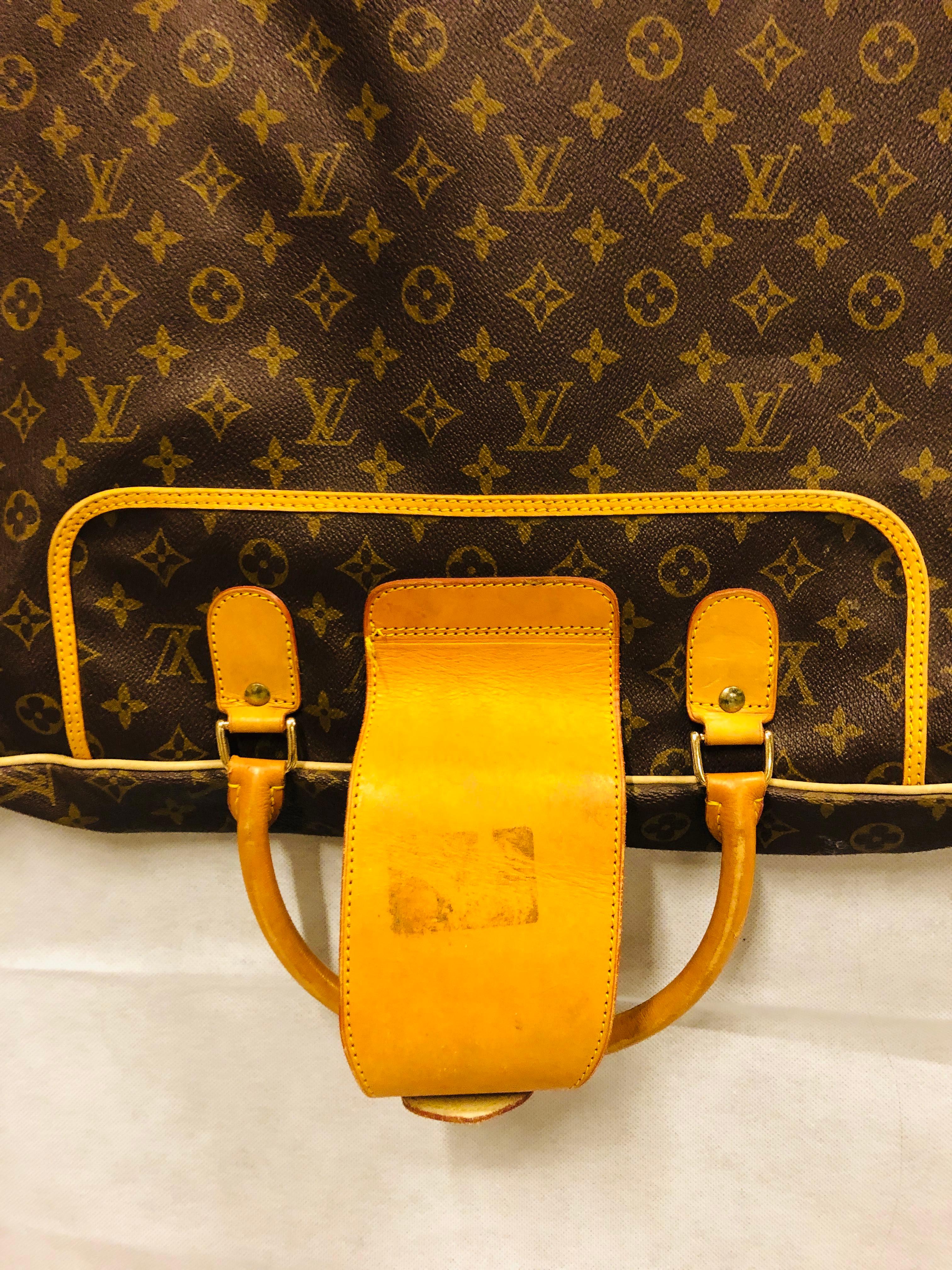 Louis Vuitton Leather Tan And Brown Monogram Garment Bag W/ Zipper Pockets.
