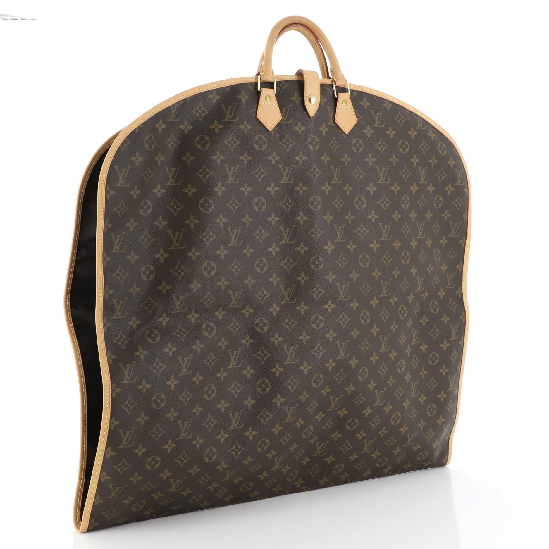 This Louis Vuitton Garment Cover Monogram Canvas, crafted in brown monogram coated canvas, features dual rolled leather handles, vachetta leather, trim, garment cover hook and gold-tone hardware. Its zip closure opens to a brown nylon interior with