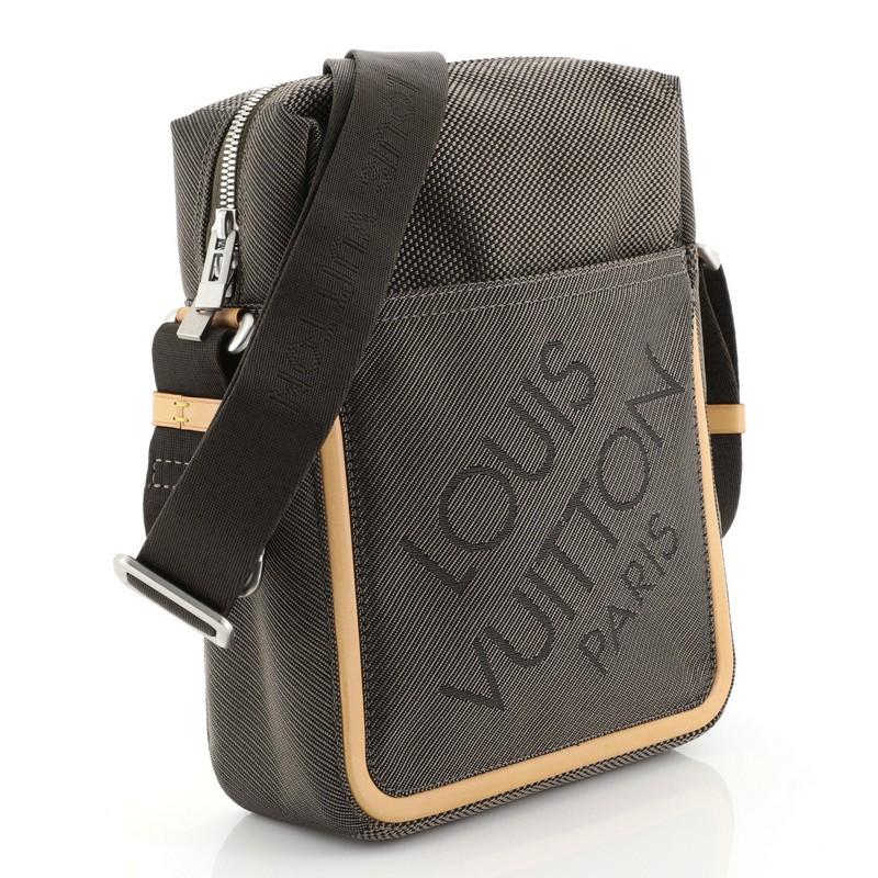 This Louis Vuitton Geant Citadin Messenger Bag Limited Edition Canvas, crafted from gray canvas, features an adjustable shoulder strap, exterior front pocket, leather trim, large logo at front, and matte silver-tone hardware. Its zip closure opens
