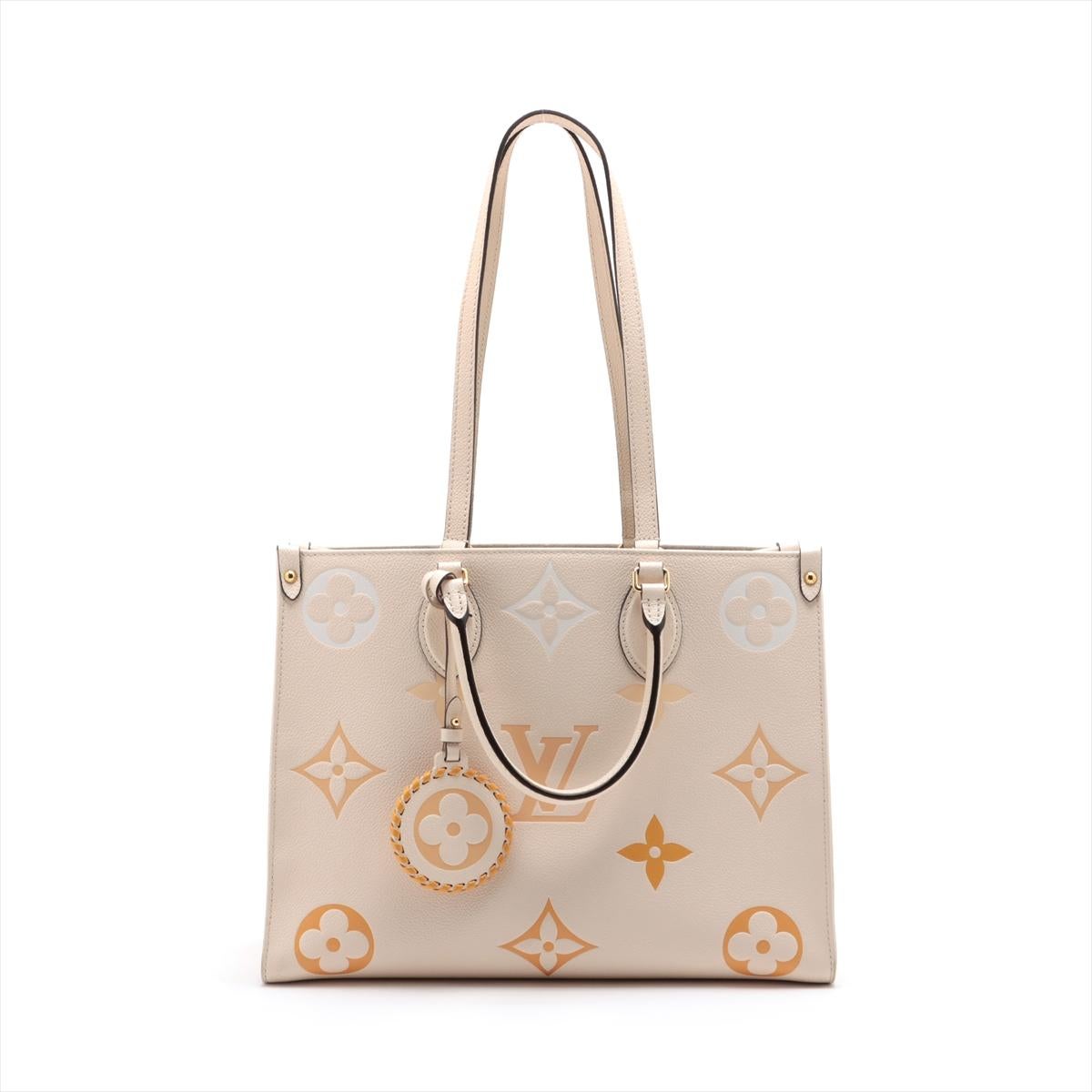 The Louis Vuitton Giant Monogram Empreinte By The Pool On the Go MM in Creme is a statement of modern luxury and sophistication. The bag features the iconic Monogram Empreinte leather with an oversized rendition, showcasing a playful and artistic