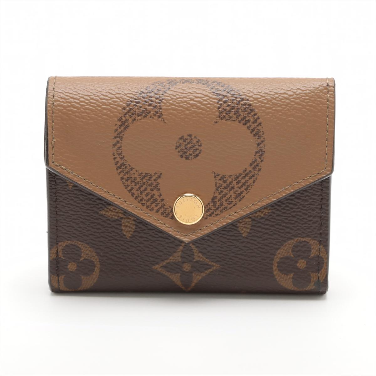 The Louis Vuitton Giant Monogram Reverse Zoé Wallet a striking and contemporary accessory that showcases the iconic Monogram pattern in a bold and vibrant design. The wallet features Giant Monogram Reverse canvas, a playful and oversized