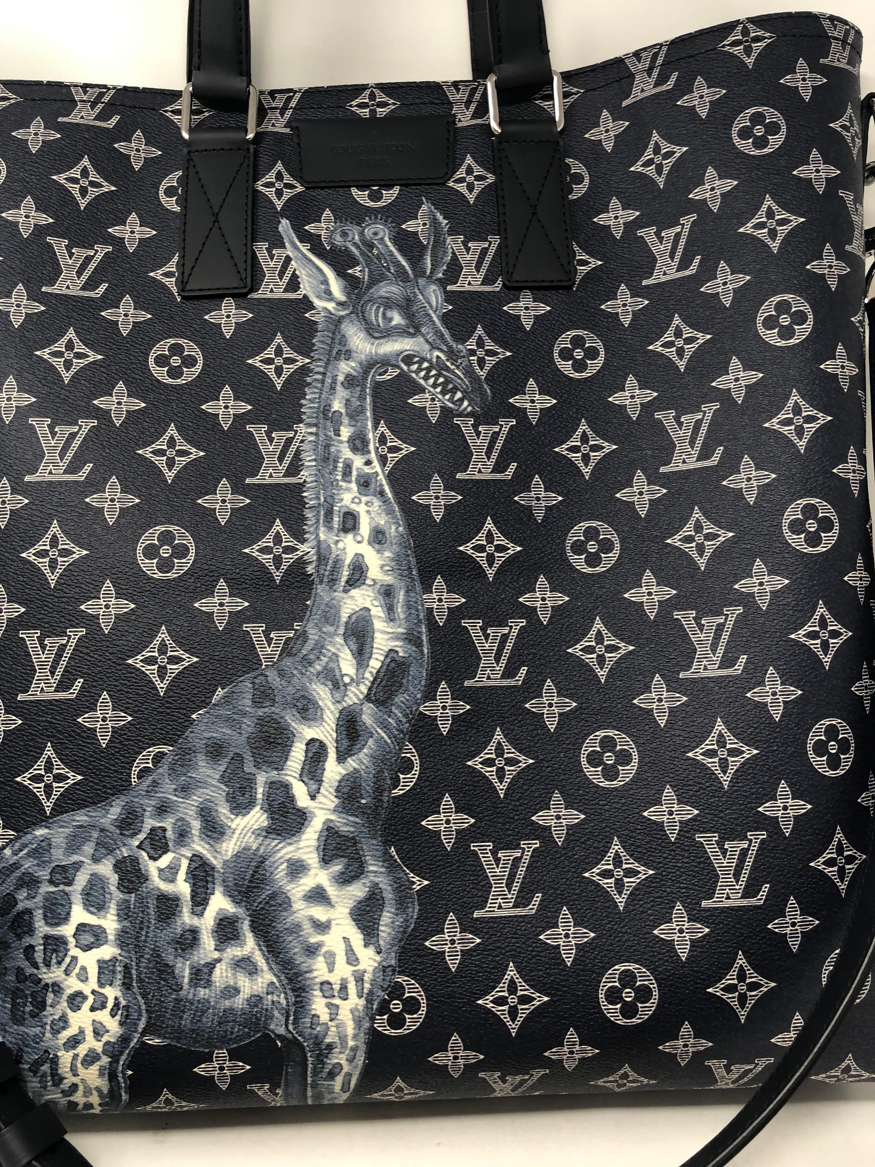 Louis Vuitton Giraffe Tote Bag by Chapman Brothers. Dark Blue indigo coated canvas and leather trim with leather strap. Chapman Brothers collaboration with LV. Rare and limited. Brand new condition. Collector's item. Don't miss out on this one.