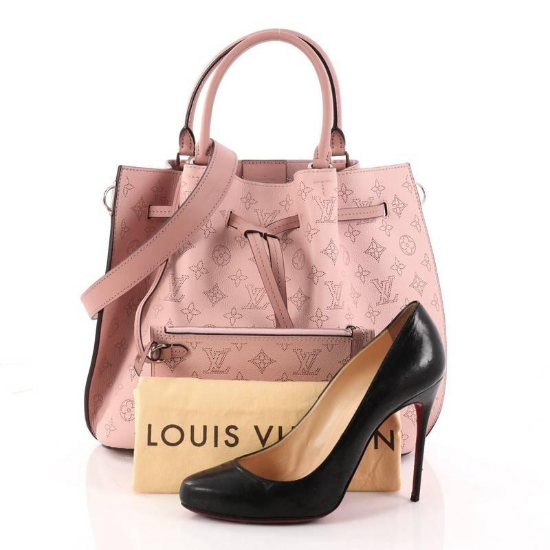 This authentic Louis Vuitton Girolata Handbag Mahina Leather from 2017 is a stylish bag that will surely be your new favorite accessory. Crafted in pink monogram mahina leather, this versatile bag features dual-rolled leather handles, protective