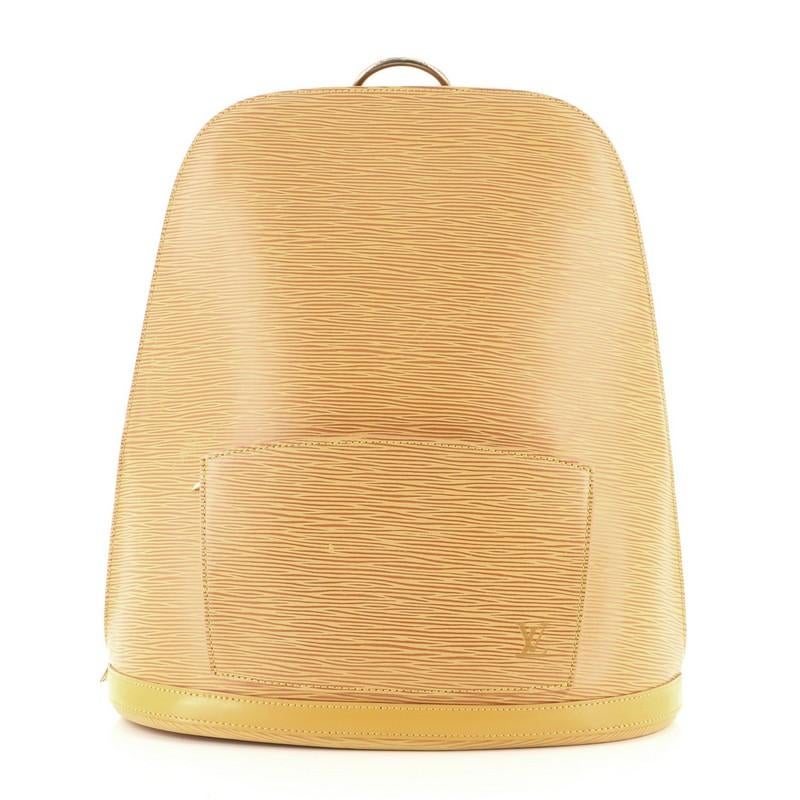 Condition: Very good. Odor in interior. Moderate wear on base trim, creasing and wear on exterior, straps and in interior, cracking on strap base wax edges. Darkening on opening zipper tape, cracking on interior pocket opening corners, scratches and