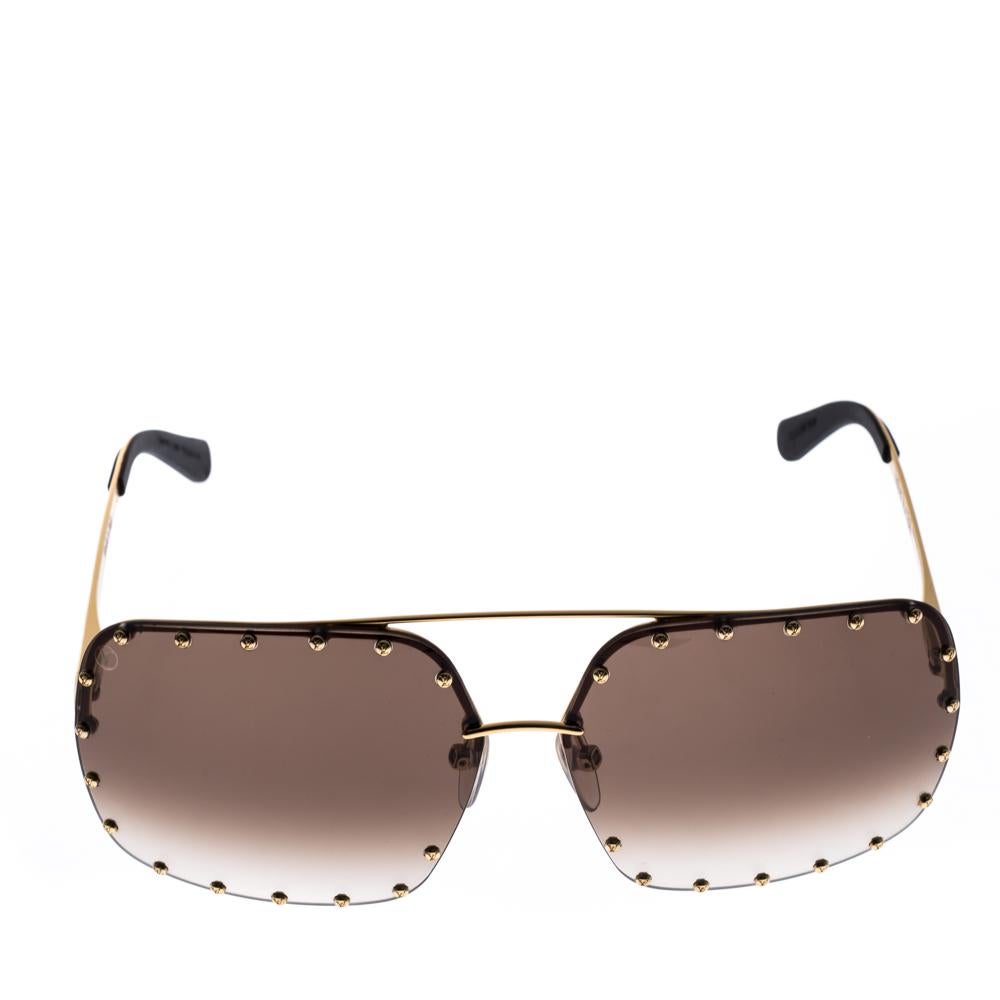 A statement-making pair from Louis Vuitton to help you achieve days of limitless style. It comes in a square design decorated with gold-tone studs and the brand name on the temples. It is fitted with high-quality lenses.

Includes:Original Pouch,