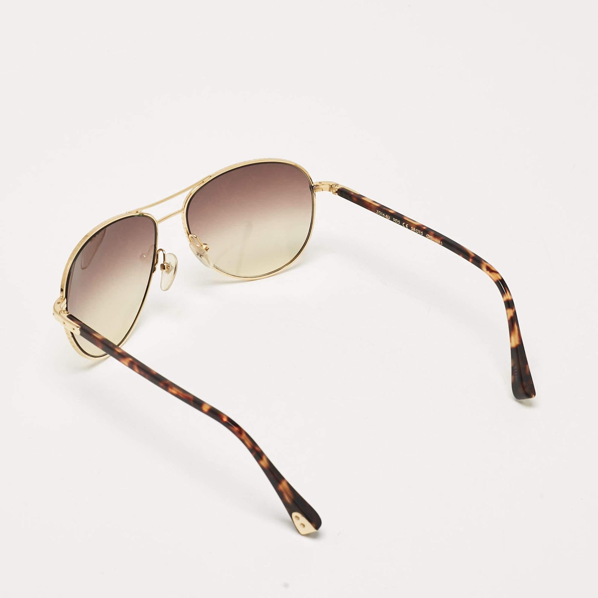 We see the detailing on this exquisite pair of designer sunglasses made from fine materials. The sunglasses are luxe in appeal and practical in usage.
