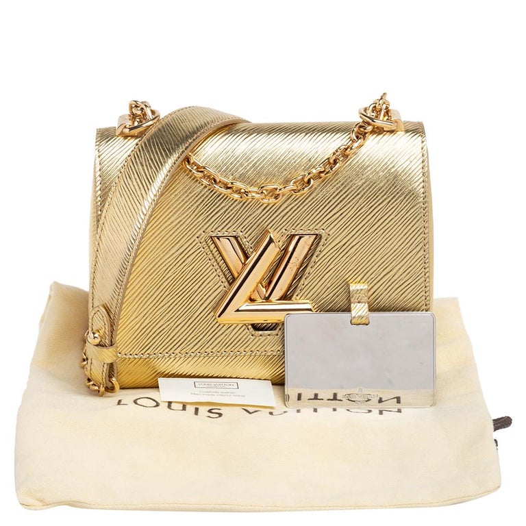 Louis Vuitton Gold Epi Leather Twist PM Bag at 1stDibs