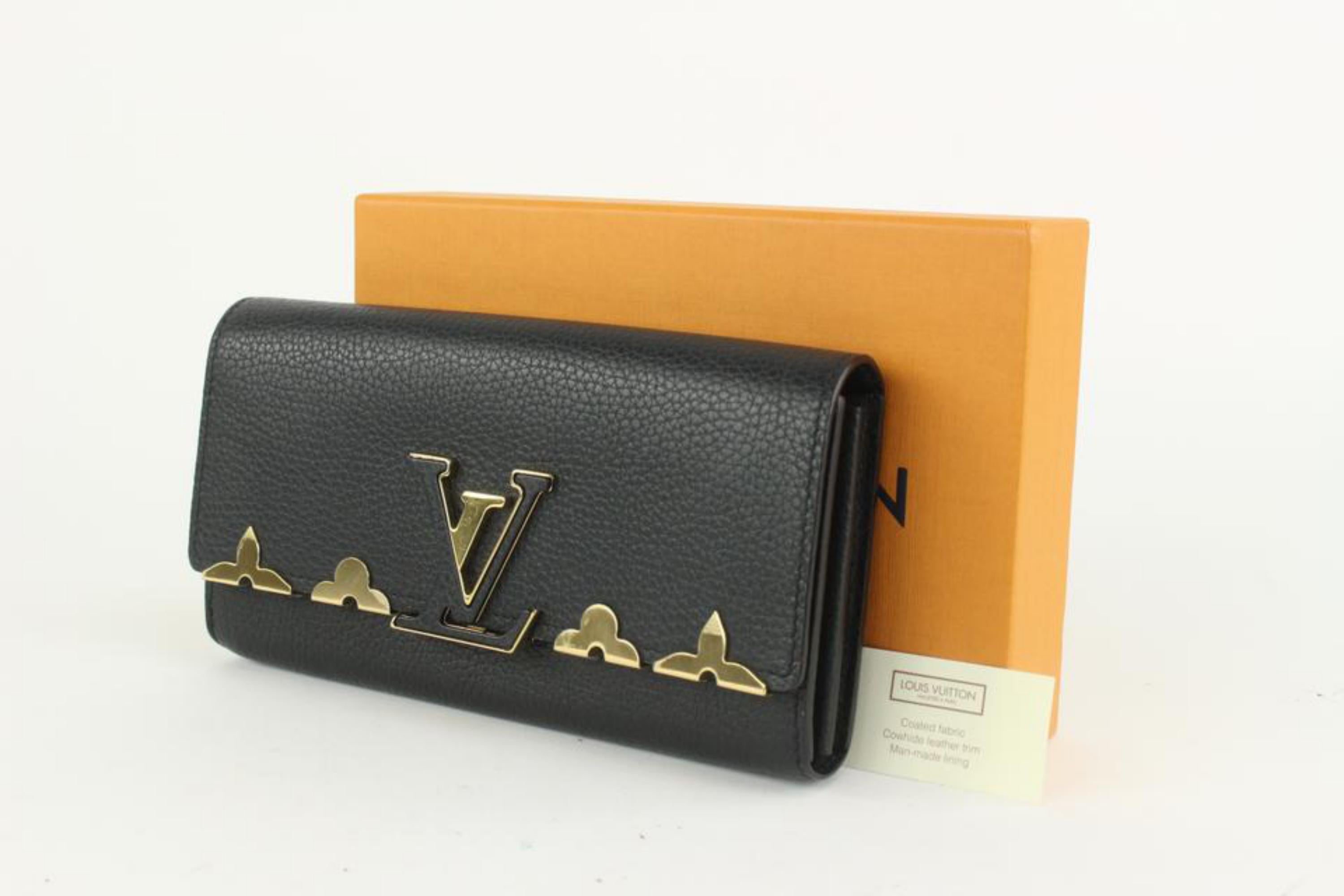Louis Vuitton Gold Fleur Black Leather Capucines Long Flap Wallet 217lv23
Date Code/Serial Number: MI2137
Made In: France
Measurements: Length:  7.75