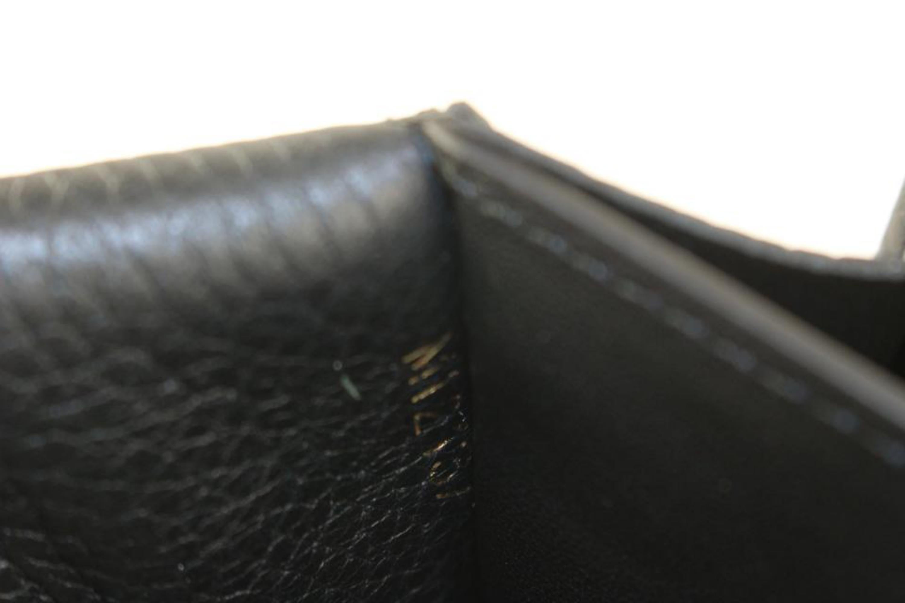 Louis Vuitton Gold Fleur Black Leather Capucines Long Flap Wallet 217lv23 In Good Condition In Dix hills, NY