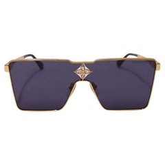 Occhiali da sole Louis Vuitton con montatura dorata e lenti scure Occhiali da sole Louis Vuitton con montatura dorata e lenti scure
