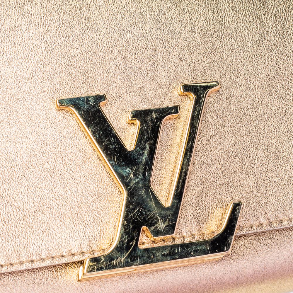 Louis Vuitton Louise Clutch aus goldenem Leder Damen