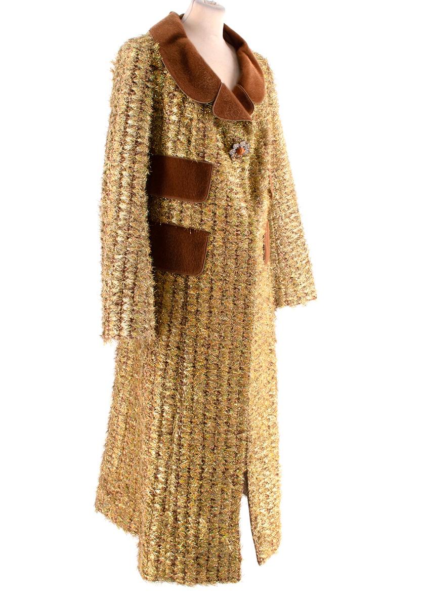 Louis Vuitton Gold Lurex Tweed Coat with Ponyskin Trim
 

 - 1960's-inspired swing coat, crafted from a tufted gold metallic lurex tweed
 - Tan brown ponyskin shawl-effect notched collar, and faux-flap pockets
 - Concealed front popper fastening